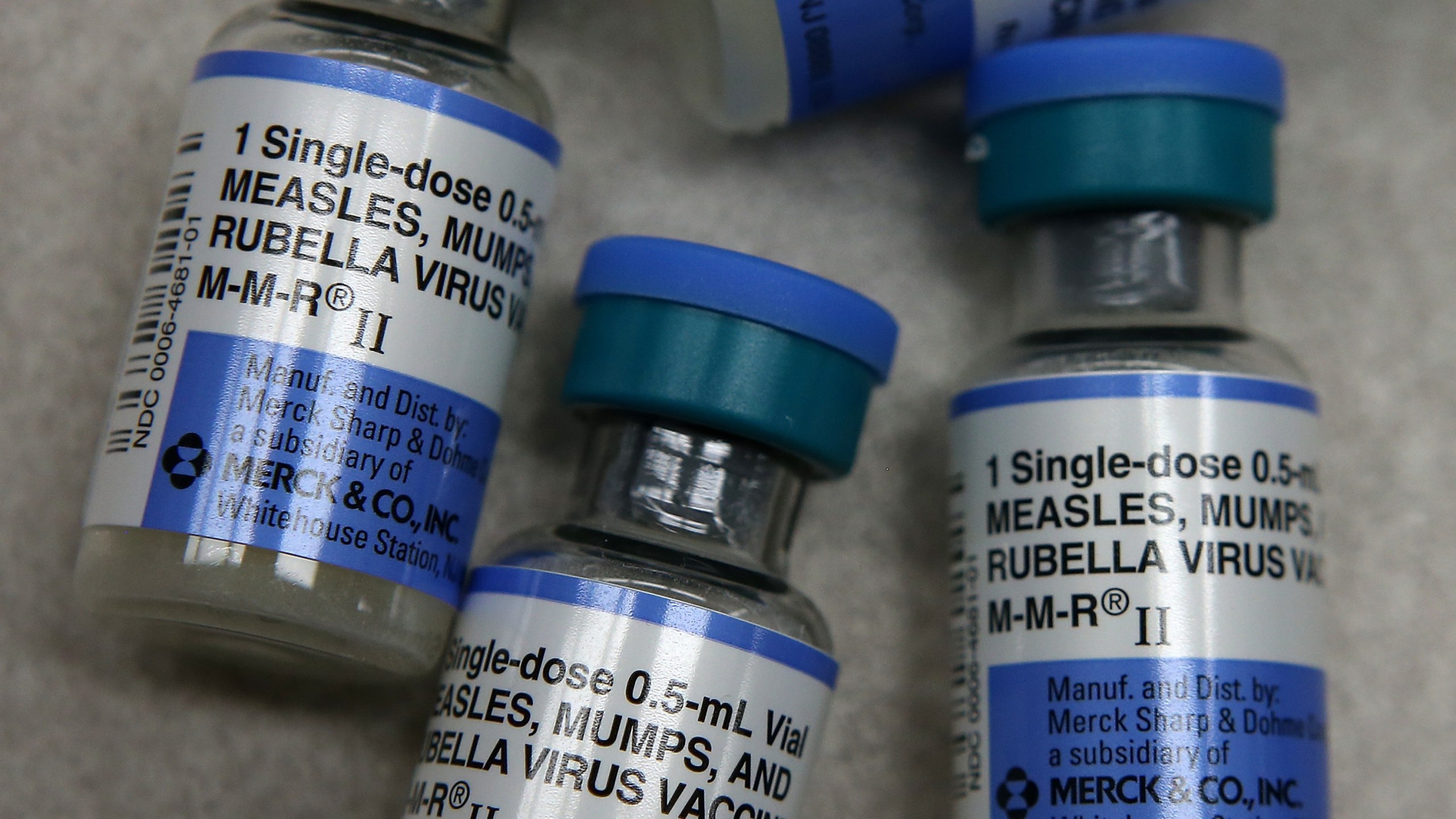 In this photo illustration, vials of measles, mumps and rubella vaccine are displayed on a counter at a Walgreens Pharmacy in Mill Valley on Jan. 26, 2015. (Credit: Justin Sullivan / Getty Images)