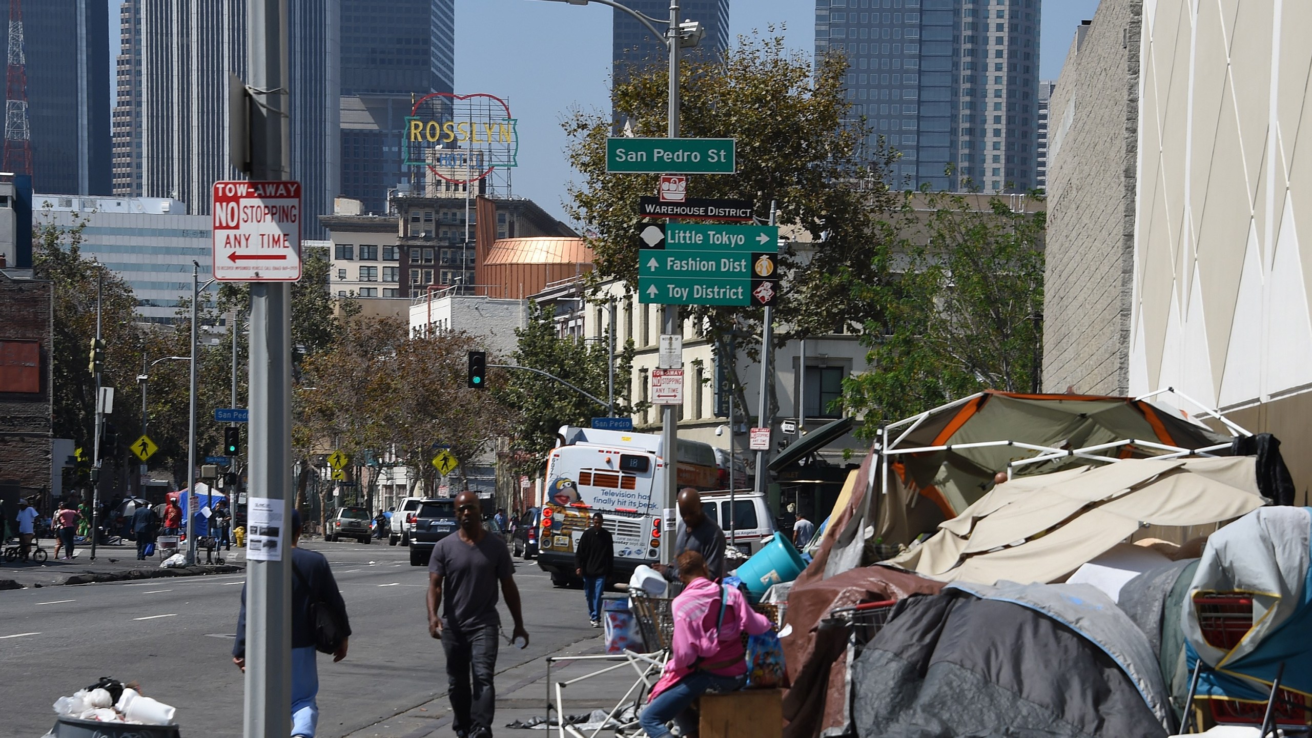 Los Angeles financial district skyscrapers are seen behind a tent encampment on Sep. 23, 2015, in downtown Los Angeles. (Credit: Robyn Beck/AFP/Getty Images)