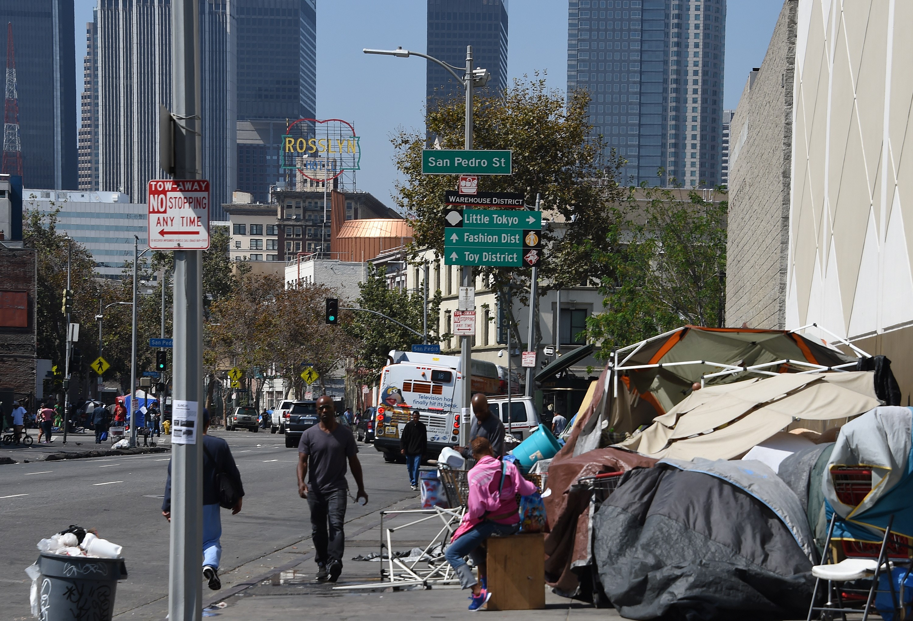 Los Angeles financial district skyscrapers are seen behind a tent encampment on Sep. 23, 2015, in downtown Los Angeles. (Credit: Robyn Beck/AFP/Getty Images)