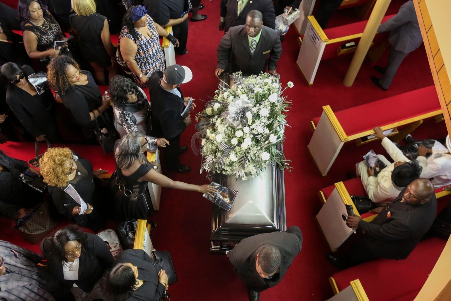 In this handout photo provided by the Palm Beach Post, The casket for Corey Jones is wheeled out of Payne Chapel AME Church following his funeral service October 31, 2015 in West Palm Beach, Florida. (Credit: Damon Higgins-Pool/Getty Images)