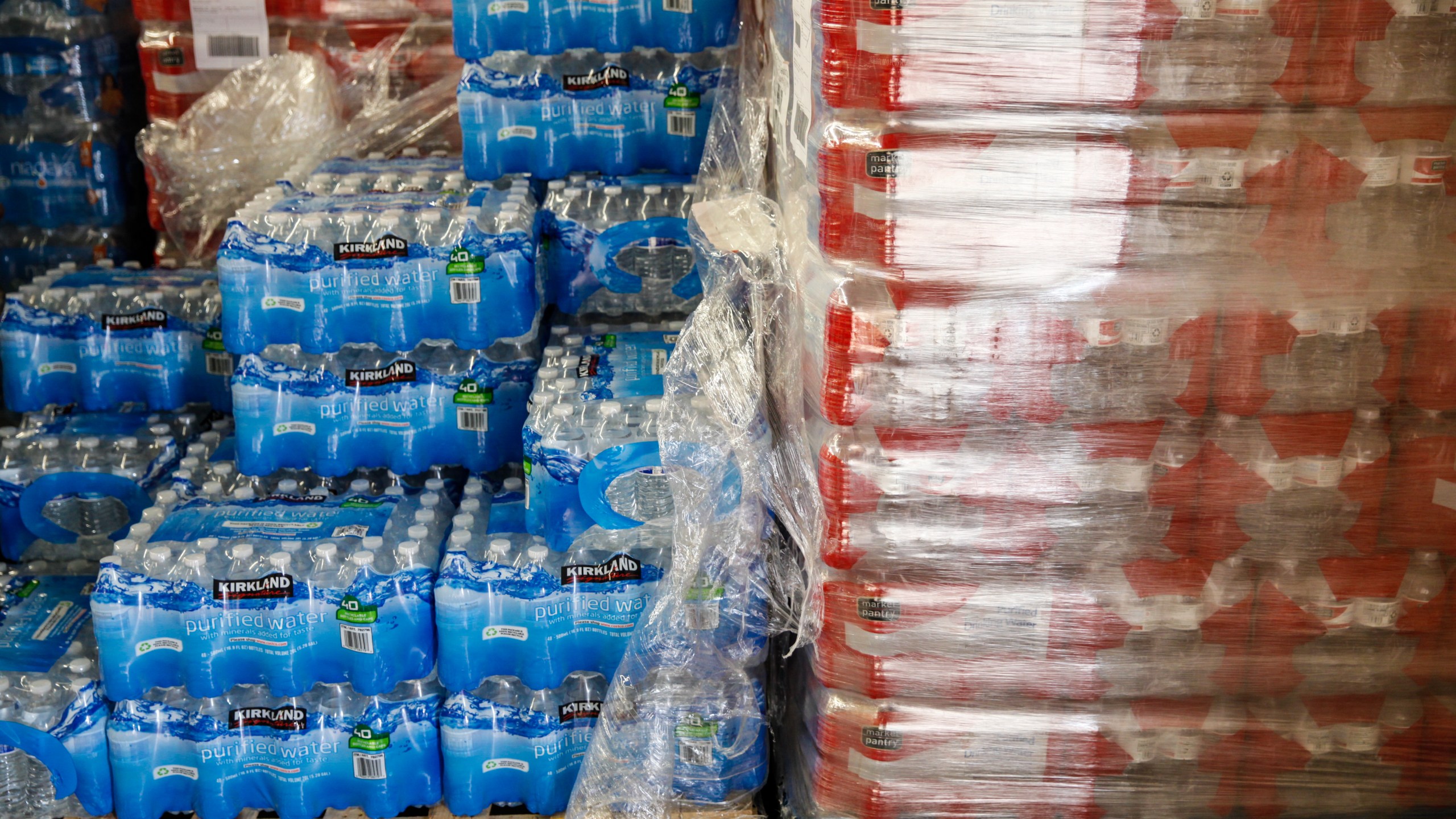 Cases of bottled water are shown at a fire station on February 7, 2016 in Flint, Michigan. (Credit: Sarah Rice/Getty Images)