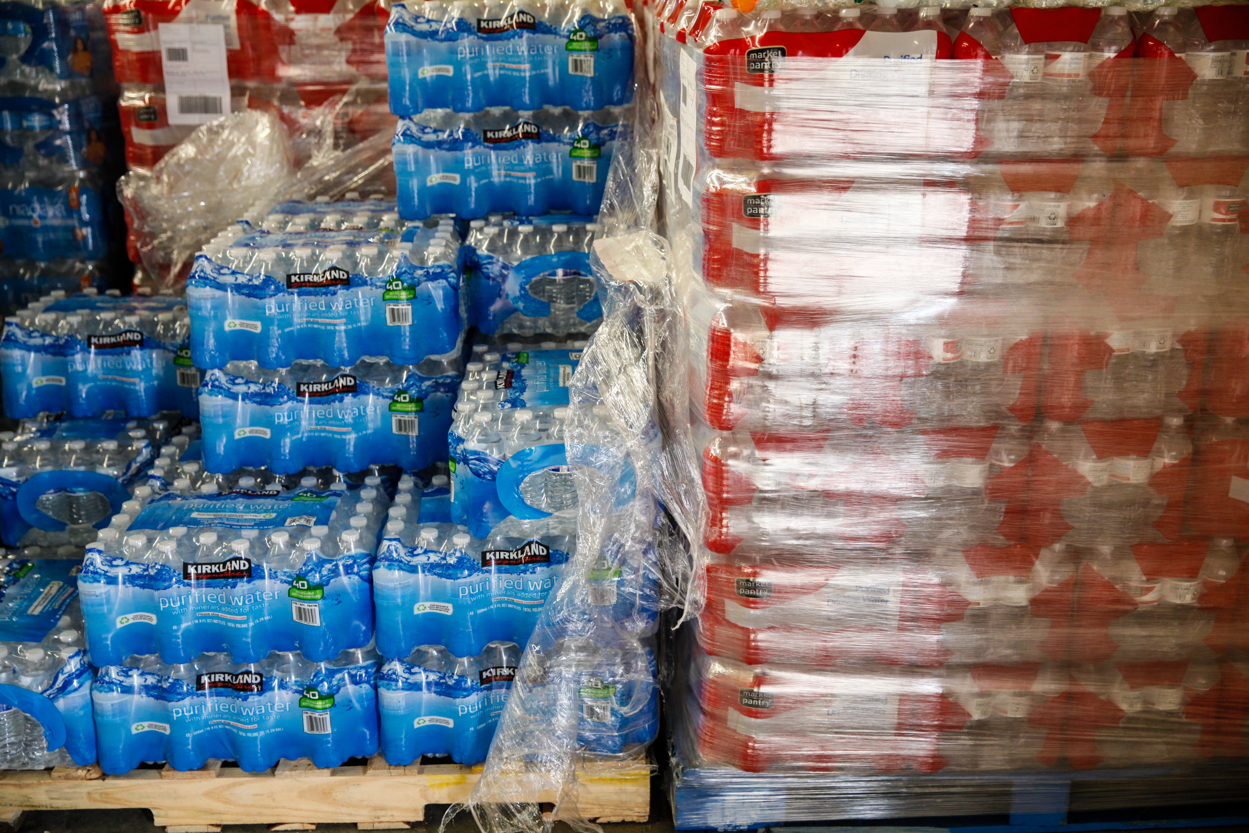 Cases of bottled water are shown at a fire station on February 7, 2016 in Flint, Michigan. (Credit: Sarah Rice/Getty Images)