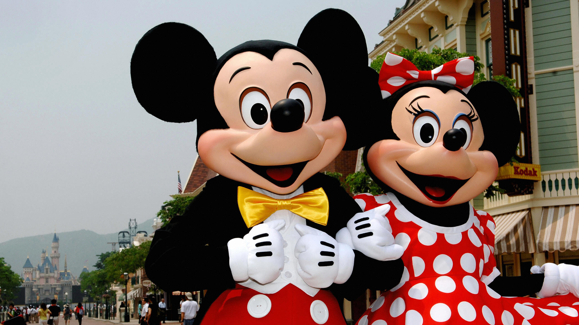 Mickey and Minnie Mouse walk around Main Street in Hong Kong Disneyland on Sep. 11, 2005. (Credit: ANDREW ROSS/AFP/Getty Images)