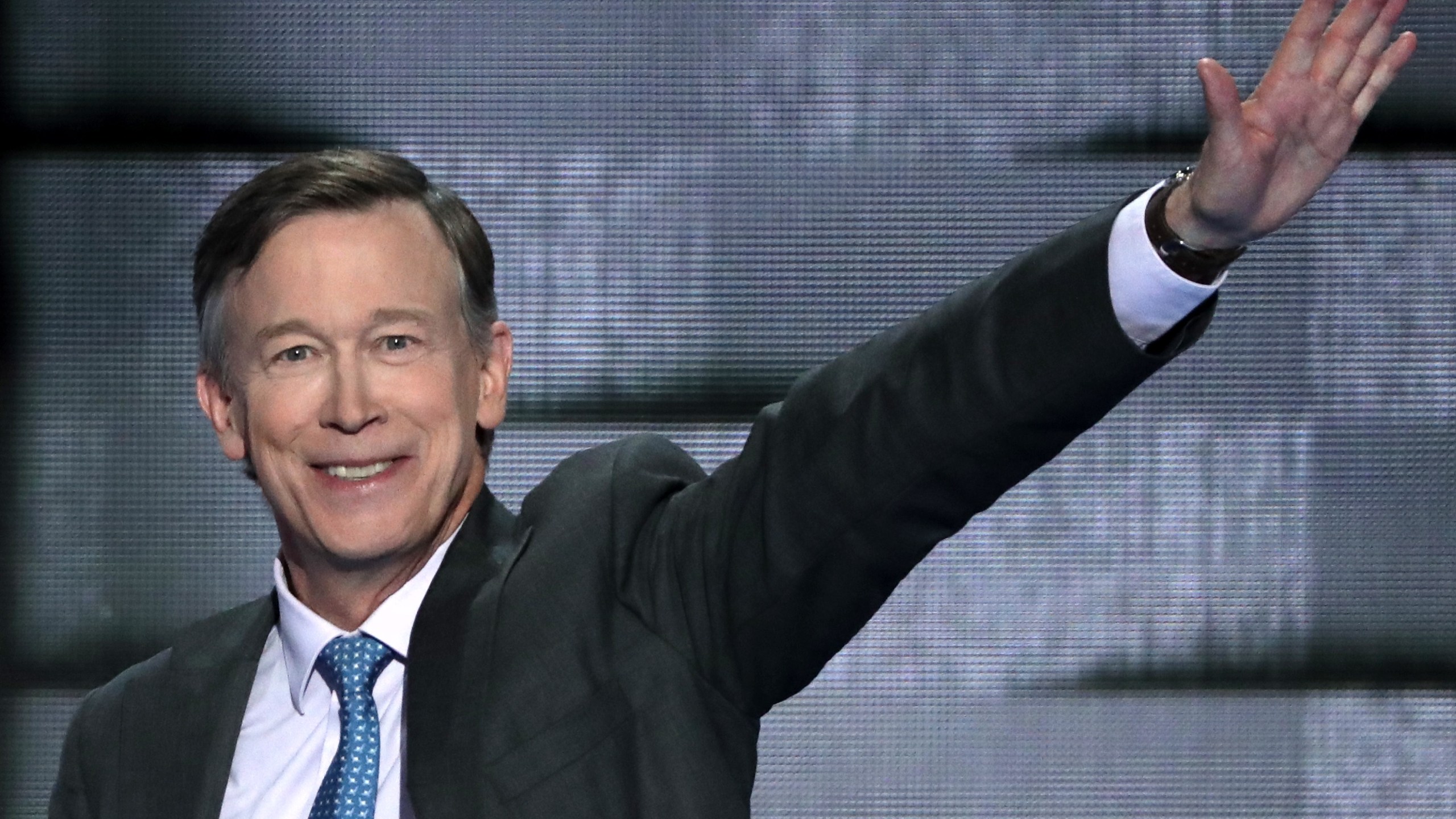 Colorado Governor John Hickenlooper (D-CO) waves to the crowd as he arrives on stage to deliver remarks on the fourth day of the Democratic National Convention at the Wells Fargo Center, July 28, 2016 in Philadelphia, Pennsylvania. (Credit: Alex Wong/Getty Images)