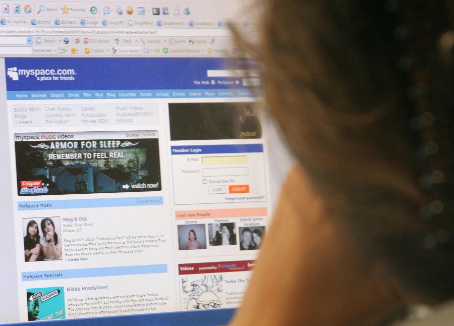 A woman looks at the MySpace website in Washington June 24, 2006. (Credit: NICHOLAS KAMM/AFP/Getty Images)