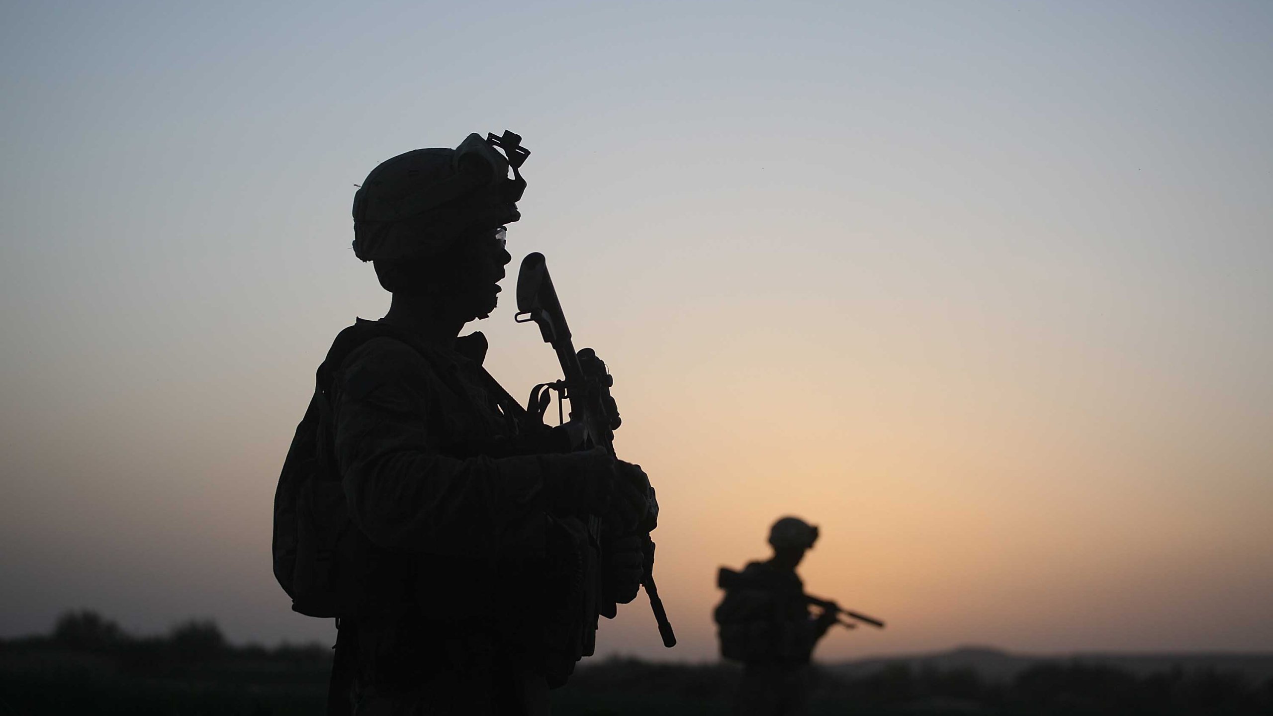 U.S. Marines with the 2nd Marine Expeditionary Brigade, RCT 2nd Battalion 8th Marines Echo Co. step off in the early morning during an operation to push out Taliban fighters on July 18, 2009 in Herati, Afghanistan . (Credit; Joe Raedle/Getty Images)