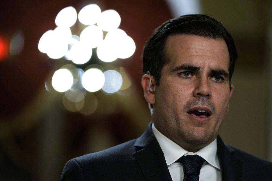 Puerto Rican Gov. Ricardo Rossello is interviewed by a TV channel after a House vote at the Capitol December 21, 2017. (Credit: Alex Wong/Getty Images)