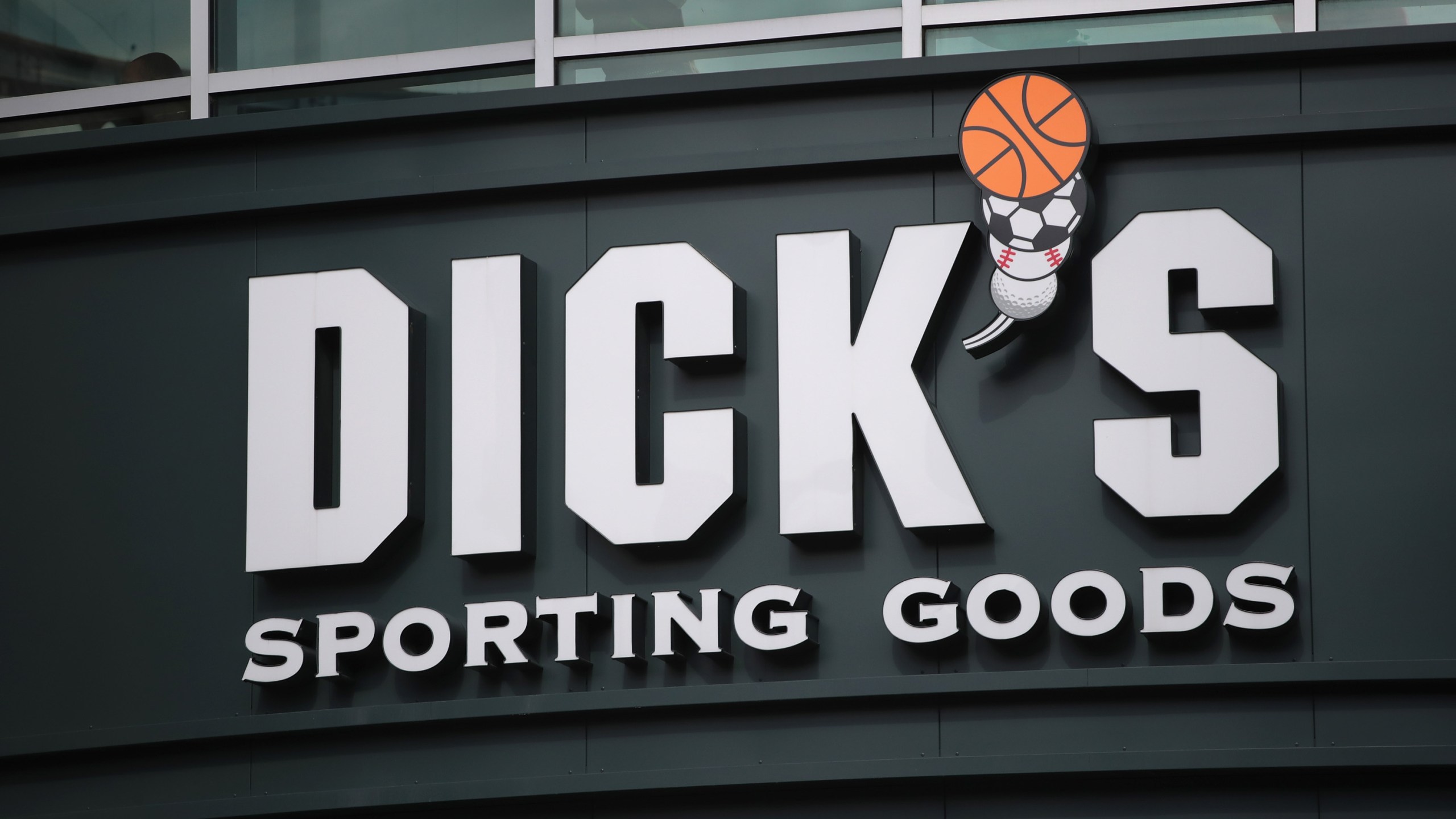 A sign hangs outside of a Dick's Sporting Goods store on February 28, 2018 in Chicago, Illinois. (Credit: Scott Olson/Getty Images)