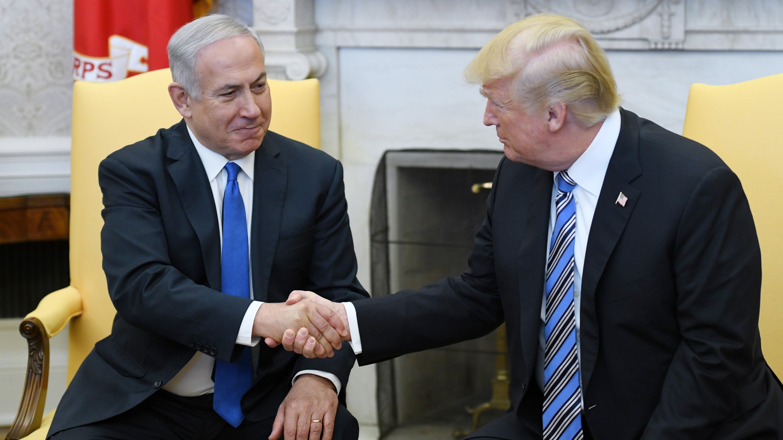 U.S. President Donald Trump shakes hands with Israel Prime Minister Benjamin Netanyahu as they meet in the Oval Office of the White House March 5, 2018, in Washington, D.C.(Credit: Olivier Douliery-Pool/Getty Images)