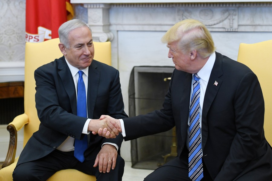 U.S. President Donald Trump shakes hands with Israel Prime Minister Benjamin Netanyahu as they meet in the Oval Office of the White House March 5, 2018, in Washington, D.C.(Credit: Olivier Douliery-Pool/Getty Images)