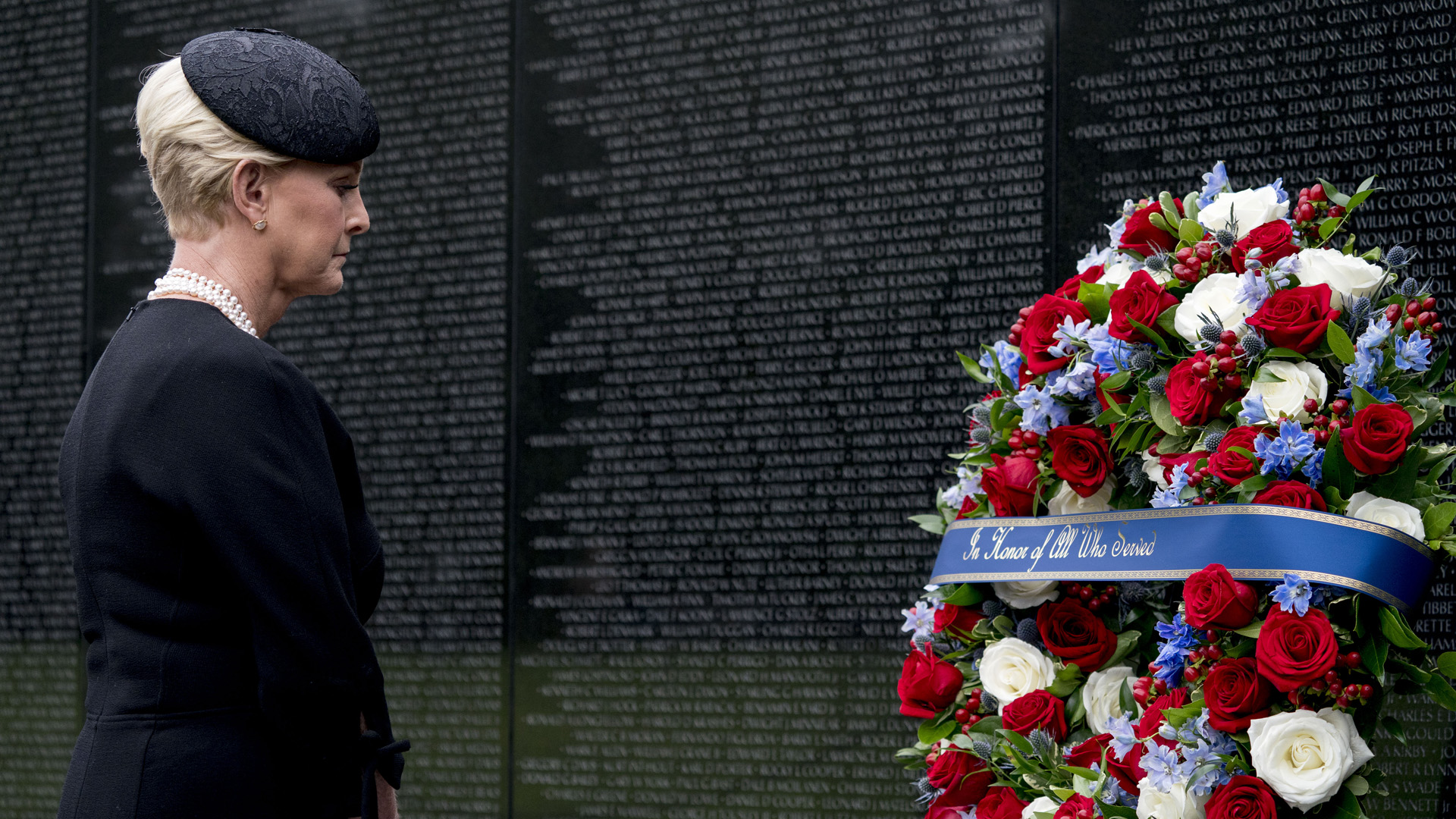 Cindy McCain, wife of, Sen. John McCain, R-Ariz., lays a wreath at the Vietnam Veterans Memorial during a funeral procession to carry the casket of her husband from the U.S. Capitol to National Cathedral for a Memorial Service on September 1, 2018 in Washington, DC.(Credit: Andrew Harnik - Pool/Getty Images)