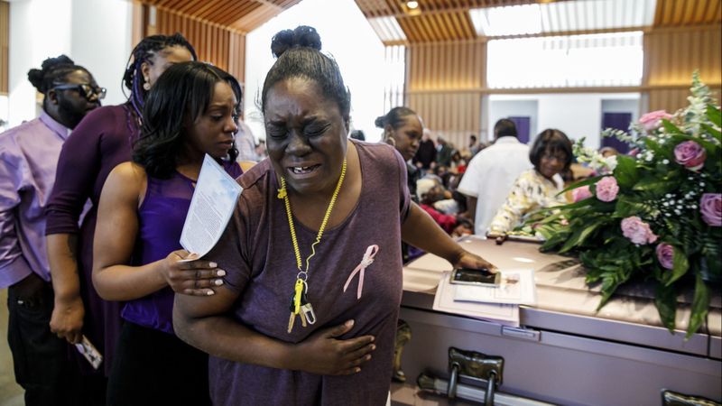 Asunoya Sanni walks away in tears after touching the casket of Trinity Love Jones during a community memorial service for the girl at St. John Vianney Catholic Church in Hacienda Heights on March 25, 2019. (Credit: Marcus Yam / Los Angeles Times)