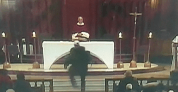 An attacker rushes the altar during a Mass in Montreal, Canada. (Credit: CNN)