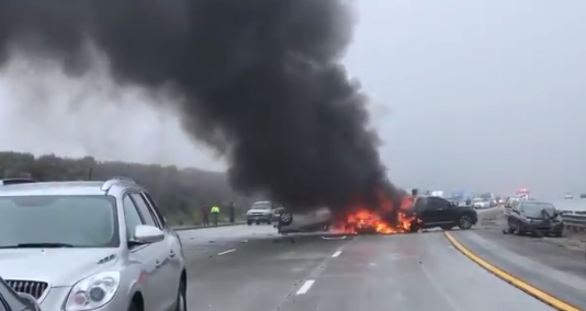 A vehicle is seen in flames at a multi-vehicle crash on the 5 Freeway near Gorman. (Credit: Viewer video)