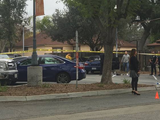 Investigators are seen at an area of the University of La Verne in this photo submitted by a KTLA viewer.