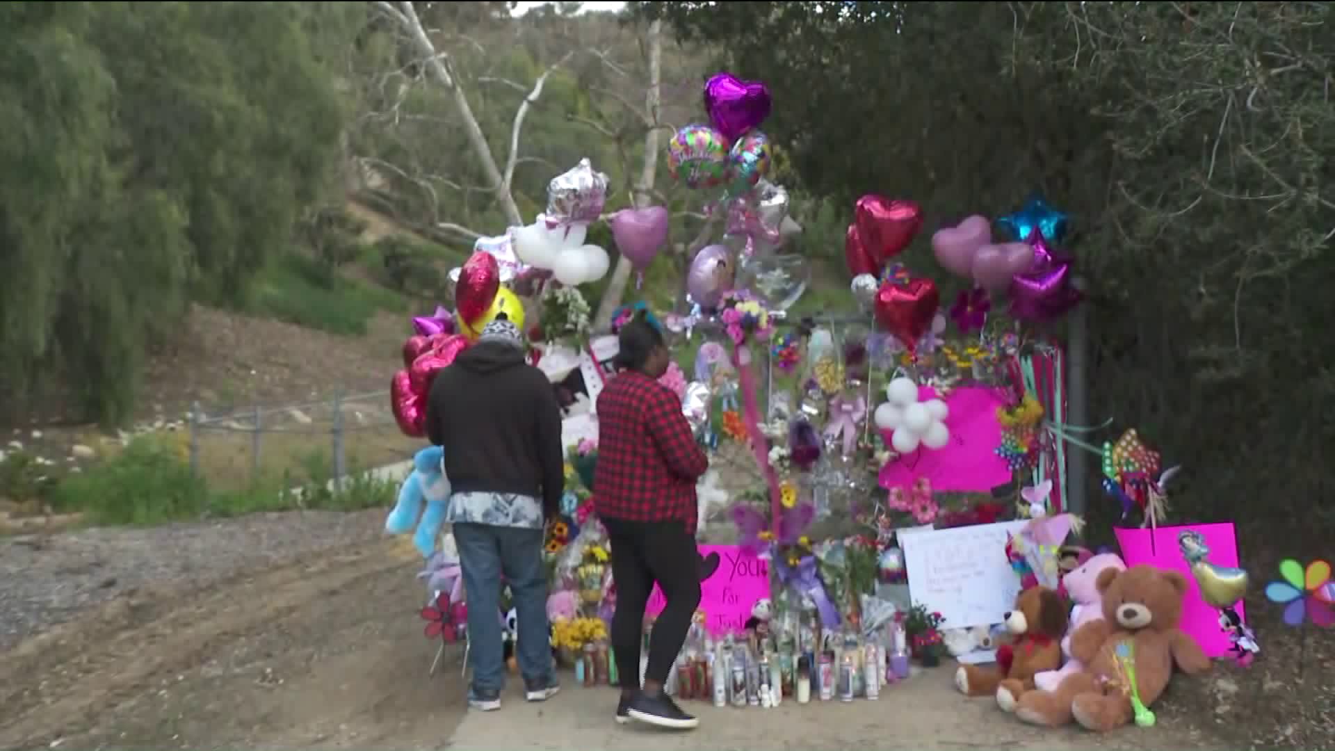 Family members gather on March 10, 2019, at the scene where a little girl was found dead inside of a duffel bag in Hacienda Heights on March 5, 2019. (Credit: KTLA)