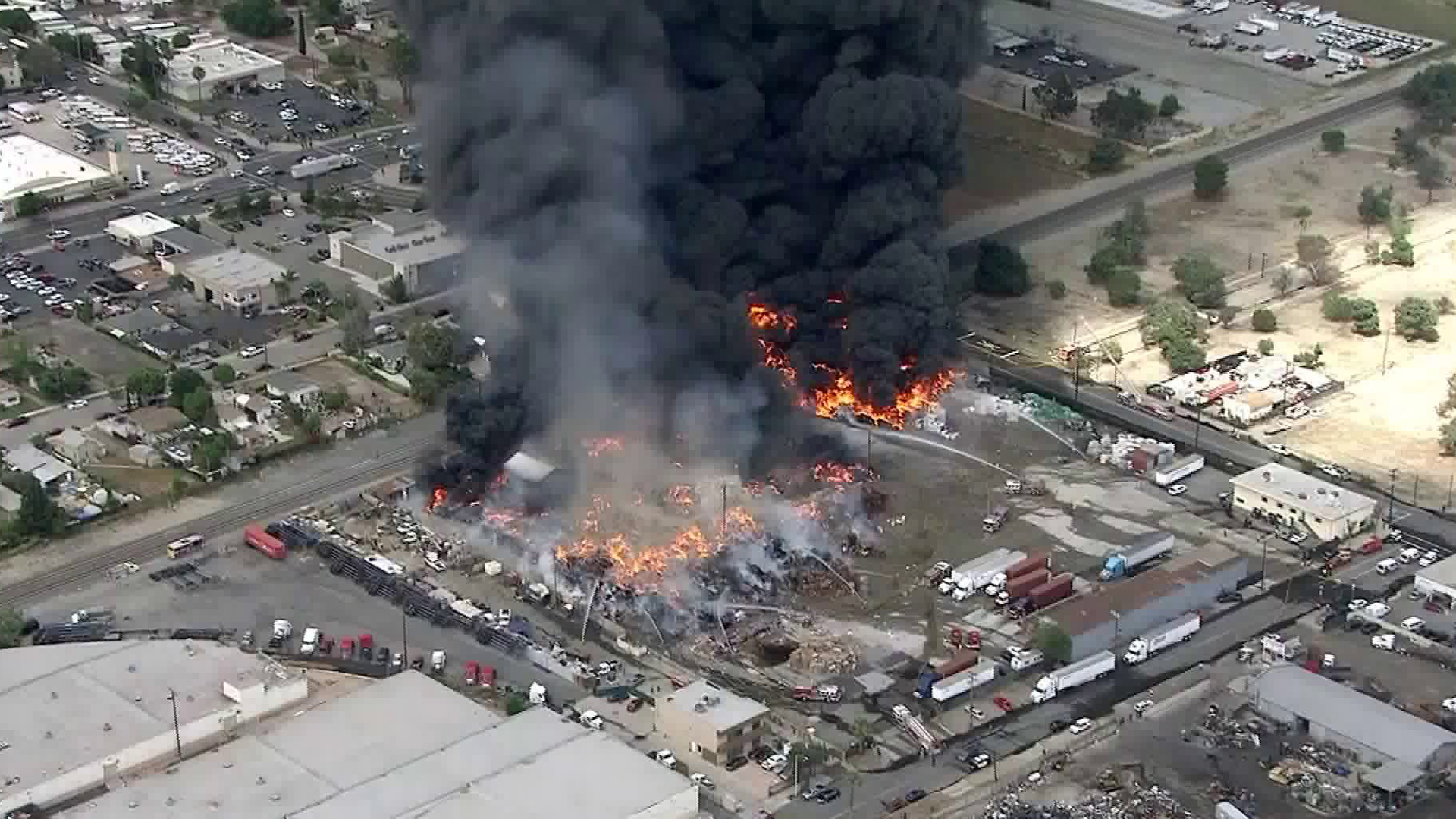 Firefighters battle a blaze at a recycling facility in Ontario on April 30, 2019. (Credit: KTLA)