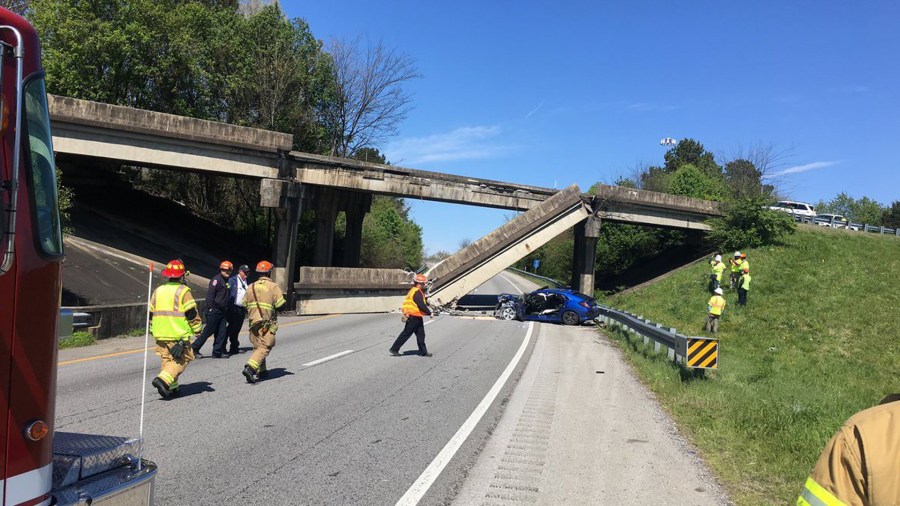 A concrete railing fell from a bridge onto the roadway below at the Interstate 75 North and Interstate 24 West split in Chattanooga, Tennessee, on Monday. (Credit: Chattanooga Fire Department)