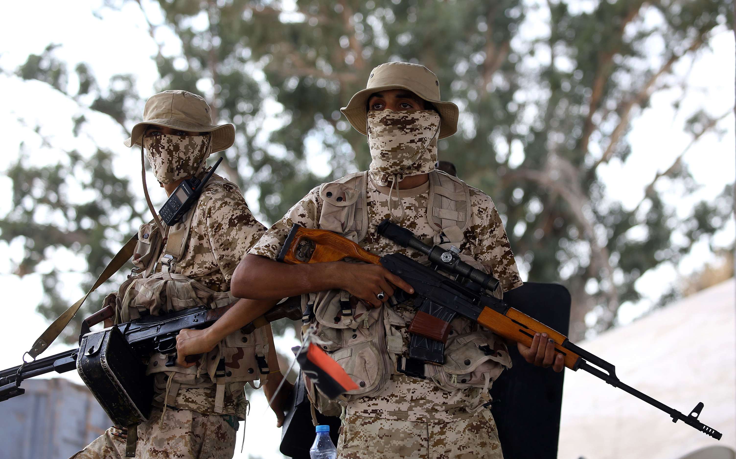 Libyan forces loyal to the Government of National Accord (GNA), Libya's internationally recognised government, keep watch from a position south of the Libyan capital Tripoli on September 25, 2018. (Credit: MAHMUD TURKIA/AFP/Getty Images)