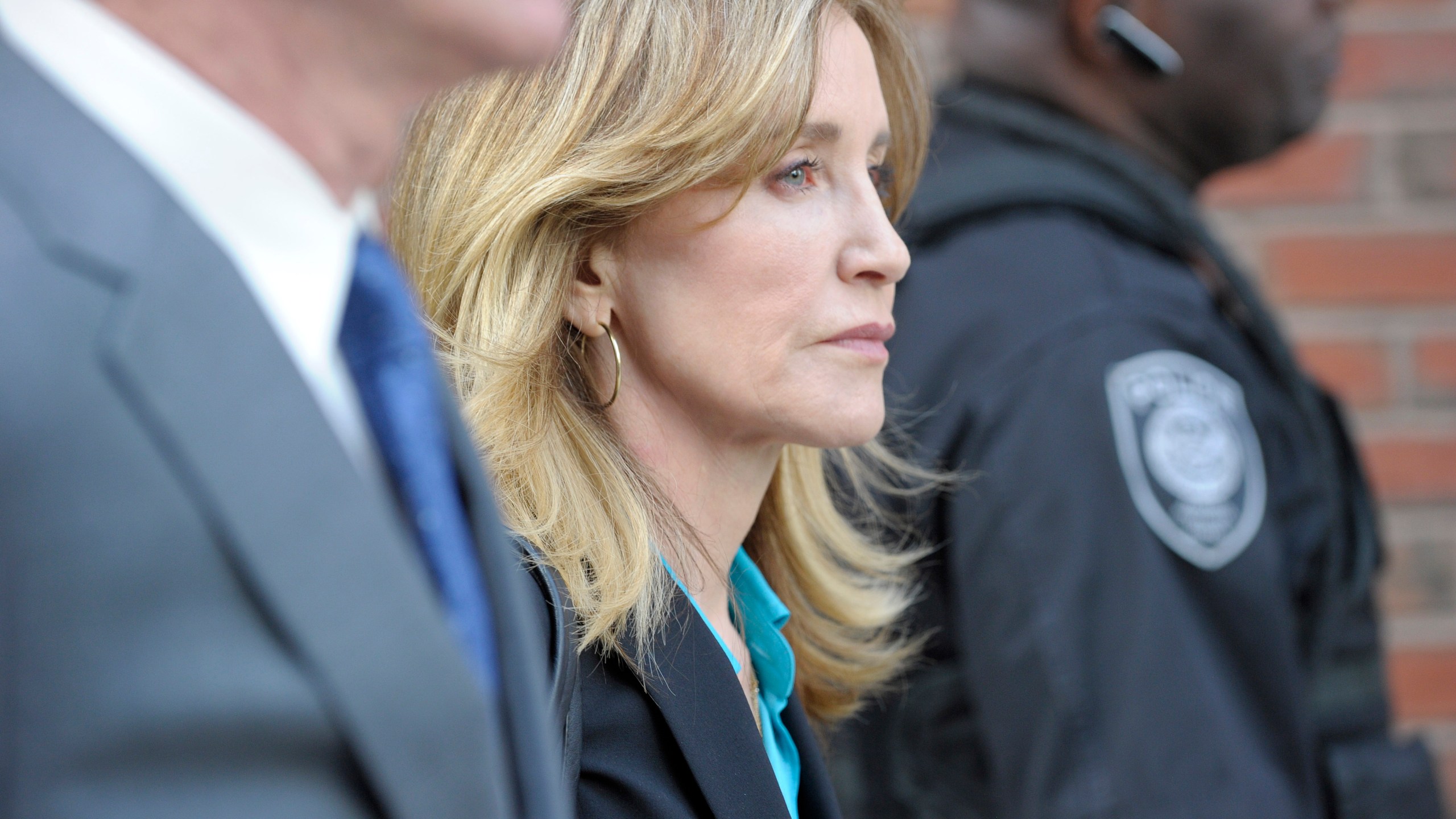 Actress Felicity Huffman exits the John Joseph Moakley United States Courthouse in Boston on April 3, 2019. (Credit: JOSEPH PREZIOSO/AFP/Getty Images)