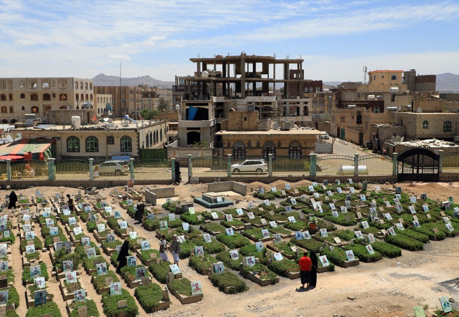 Yemenis visit a cemetery in the capital Sanaa on April 5, 2019. The World Health Organization estimates nearly 10,000 Yemenis have been killed since 2015, when Saudi Arabia and its allies intervened to prevent the defeat of the government in the face of a rebel offensive. (Credit: Mohammed Huwais / AFP / Getty Images)