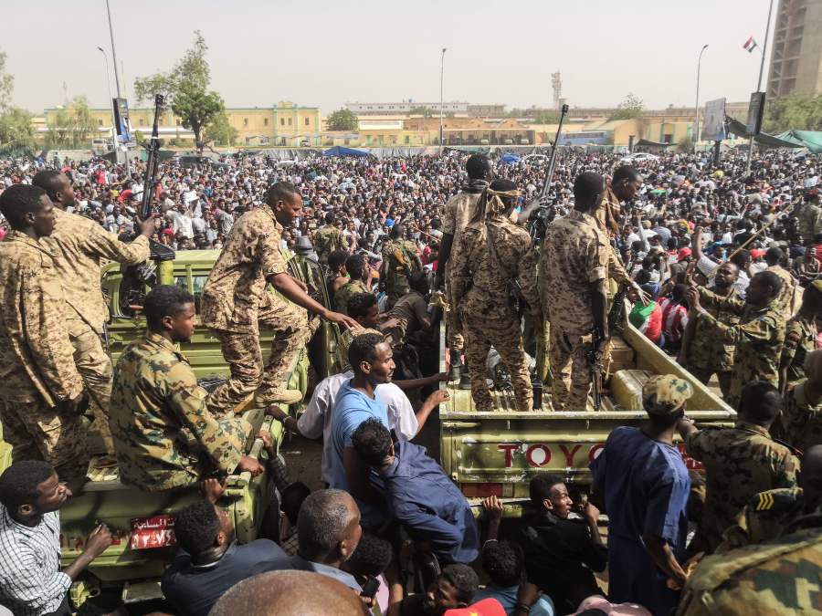 Sudanese soldiers stand guard on armoured military vehicles as demonstrators continue their protest against the regime near the army headquarters in the Sudanese capital Khartoum on April 11, 2019.(Credit: -/AFP/Getty Images)