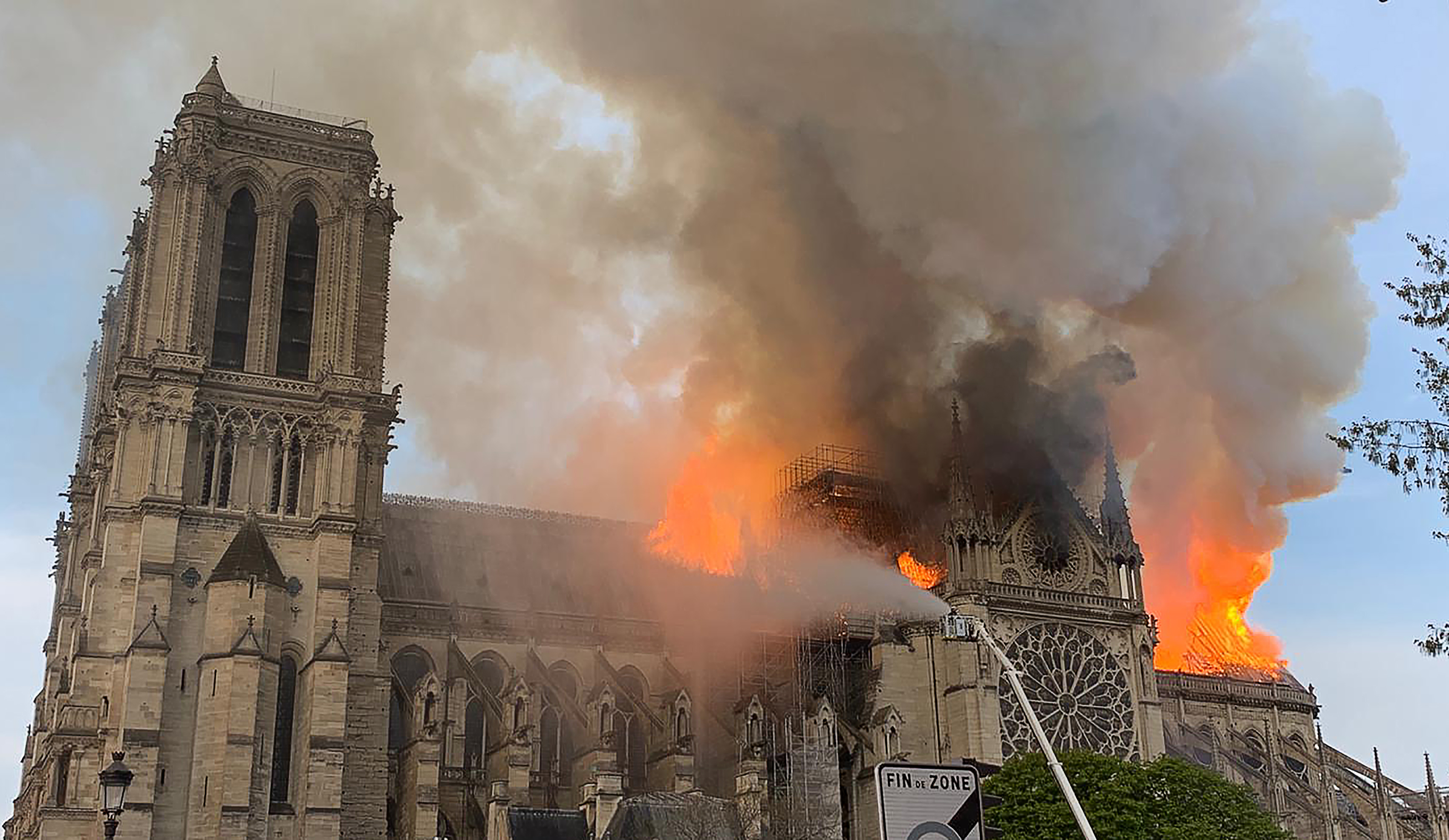 Flames and smoke are seen billowing from the roof at Notre-Dame Cathedral in Paris on April 15, 2019. (Credit: PATRICK ANIDJAR/AFP/Getty Images)