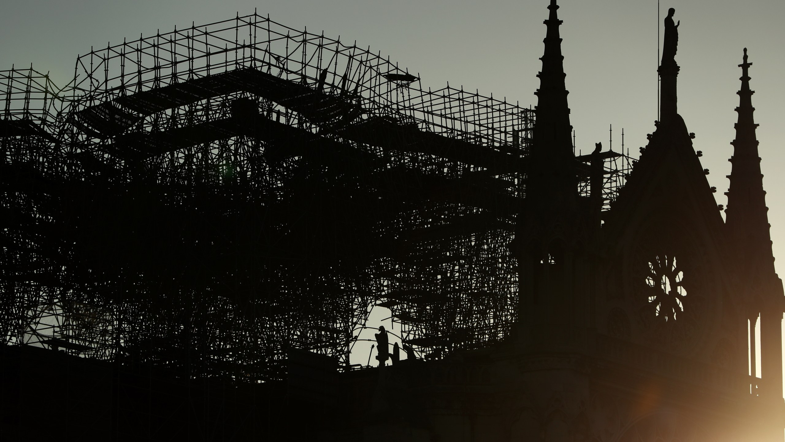 A silhouette of Notre-Dame Cathedral is seen at sunrise following a major fire on Monday on April 17, 2019 in Paris, France. (Credit: Dan Kitwood/Getty Images)