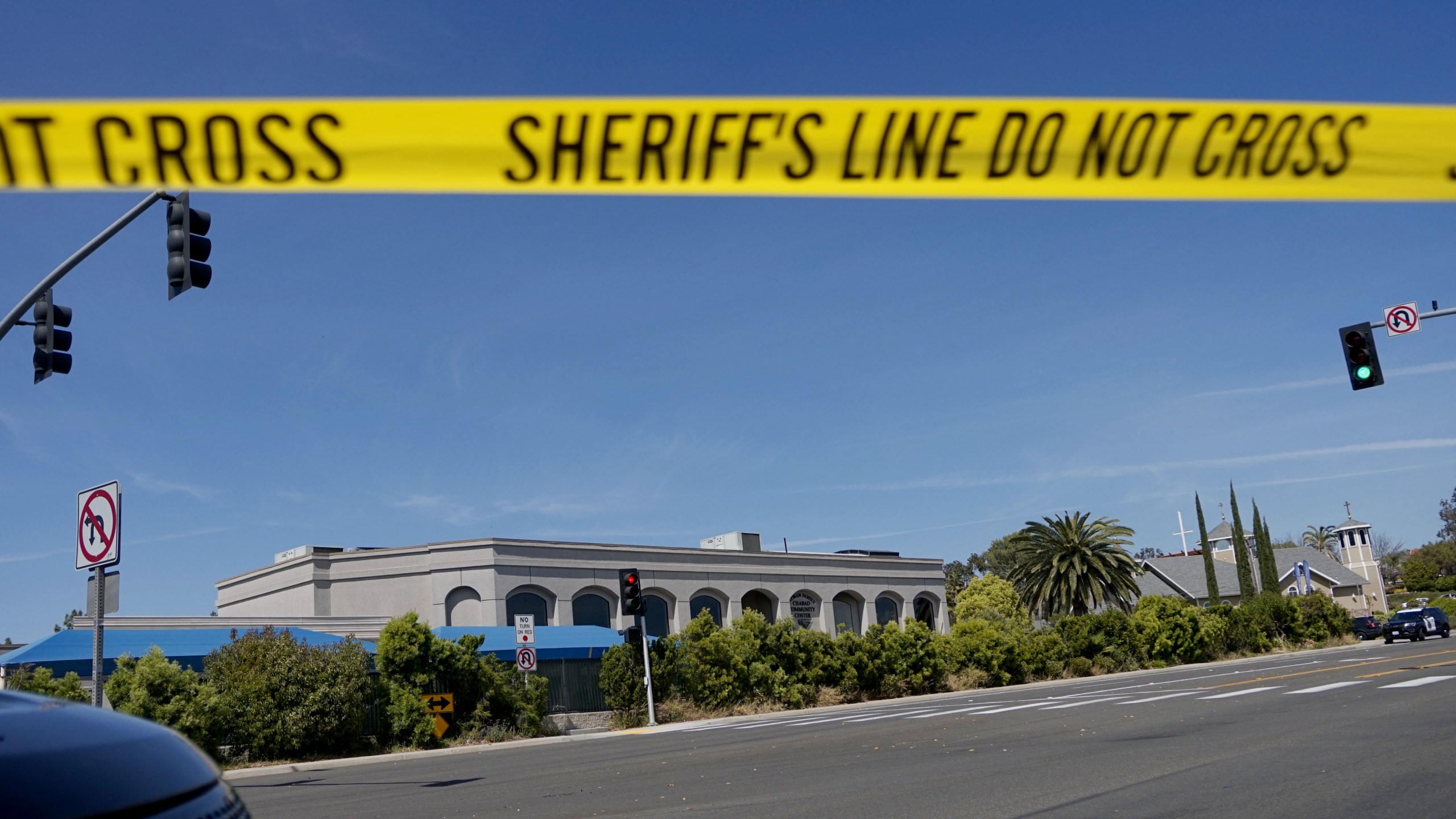 Sheriff's crime scene tape is placed in front of the Chabad of Poway Synagogue after a shooting on Saturday, April 27, 2019 in Poway, California. (Credit: SANDY HUFFAKER/AFP/Getty Images)