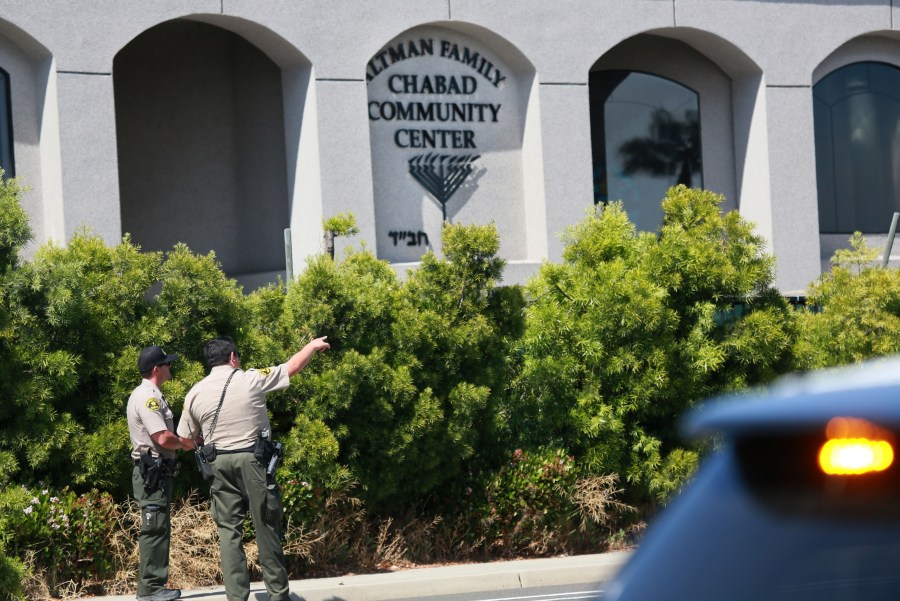 San Diego Sheriff deputies look over the Chabad of Poway Synagogue after a shooting on Saturday, April 27, 2019, in Poway. (Credit: SANDY HUFFAKER/AFP/Getty Images)