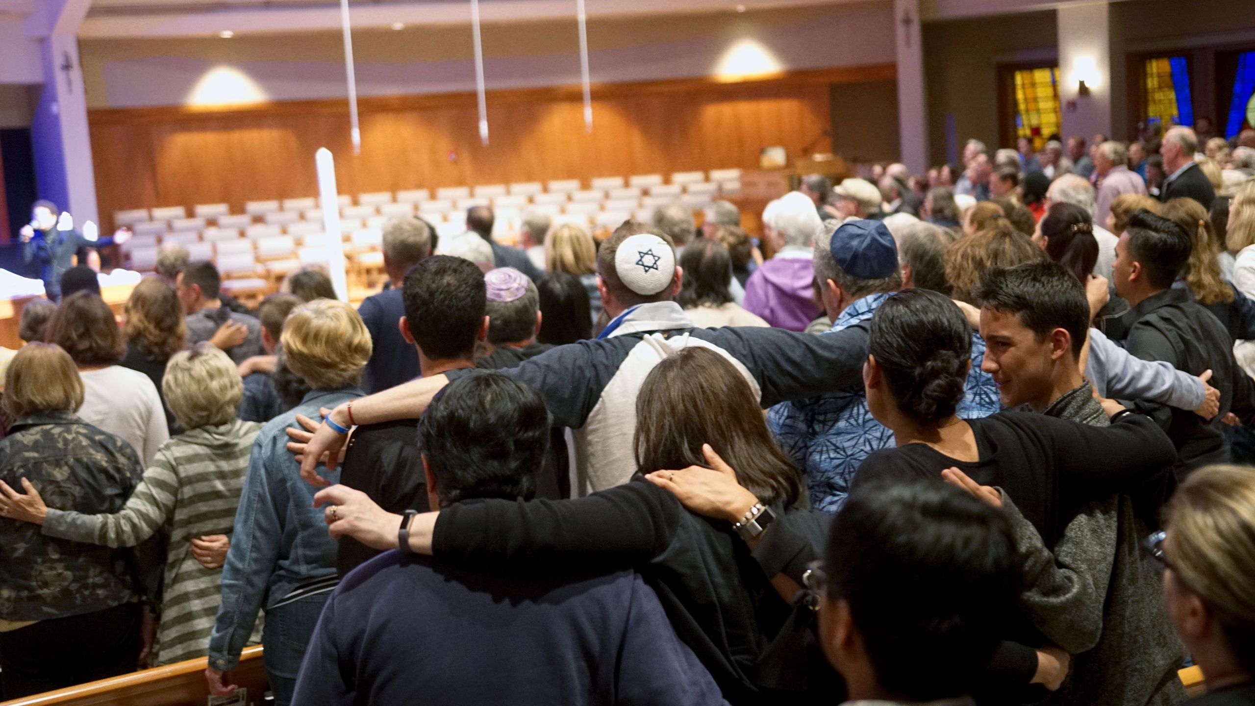 Mourners participate in a vigil for the victims of the Chabad of Poway Synagogue shooting at the Rancho Bernardo Community Presbyterian Church on April 27, 2019. (Credit: SANDY HUFFAKER/AFP/Getty Images)