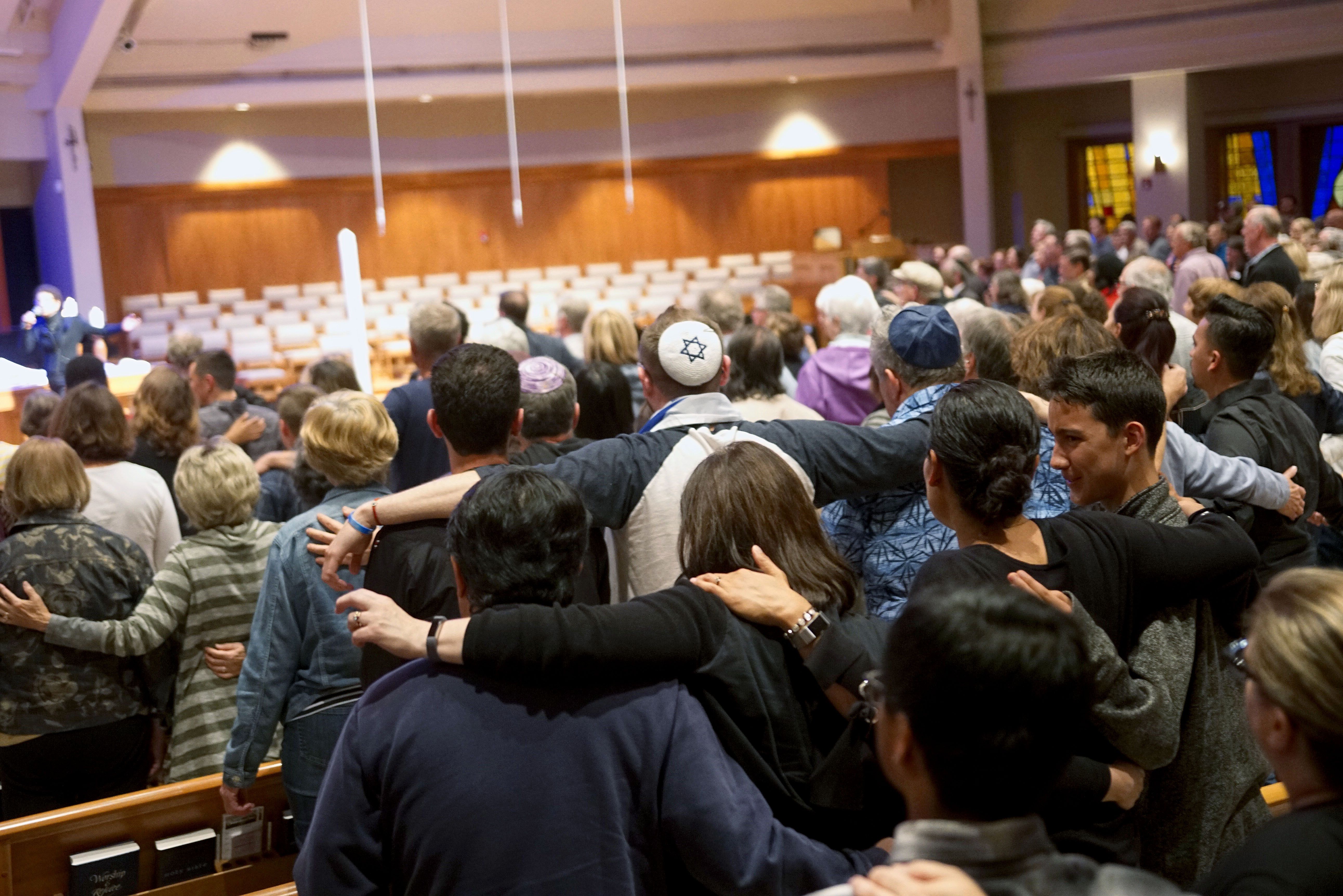 Mourners participate in a vigil for the victims of the Chabad of Poway Synagogue shooting at the Rancho Bernardo Community Presbyterian Church on April 27, 2019. (Credit: SANDY HUFFAKER/AFP/Getty Images)