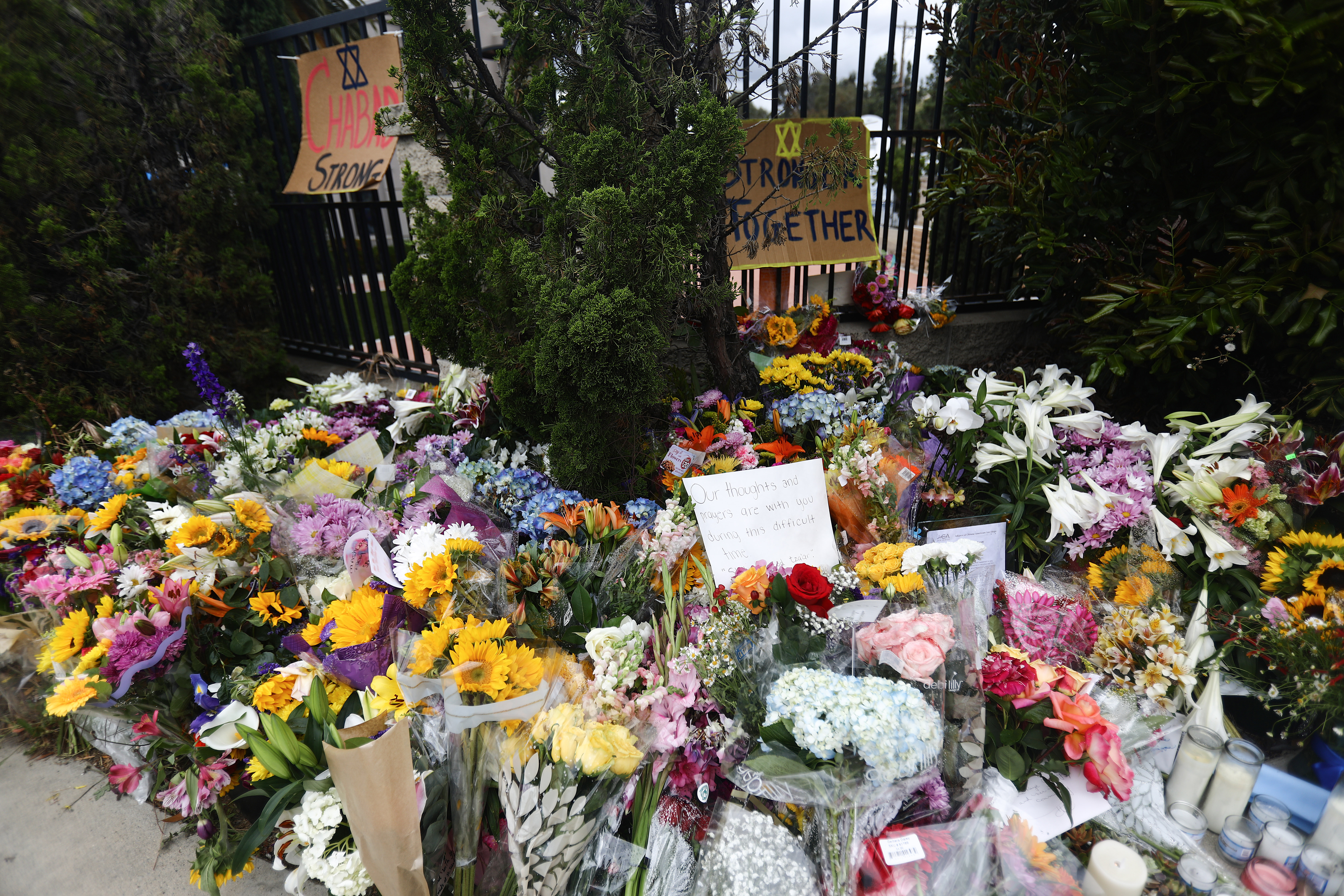 Flowers and mementos are left outside the funeral for Lori Gilbert Kaye on April 29, 2019. (Credit: Mario Tama/Getty Images)