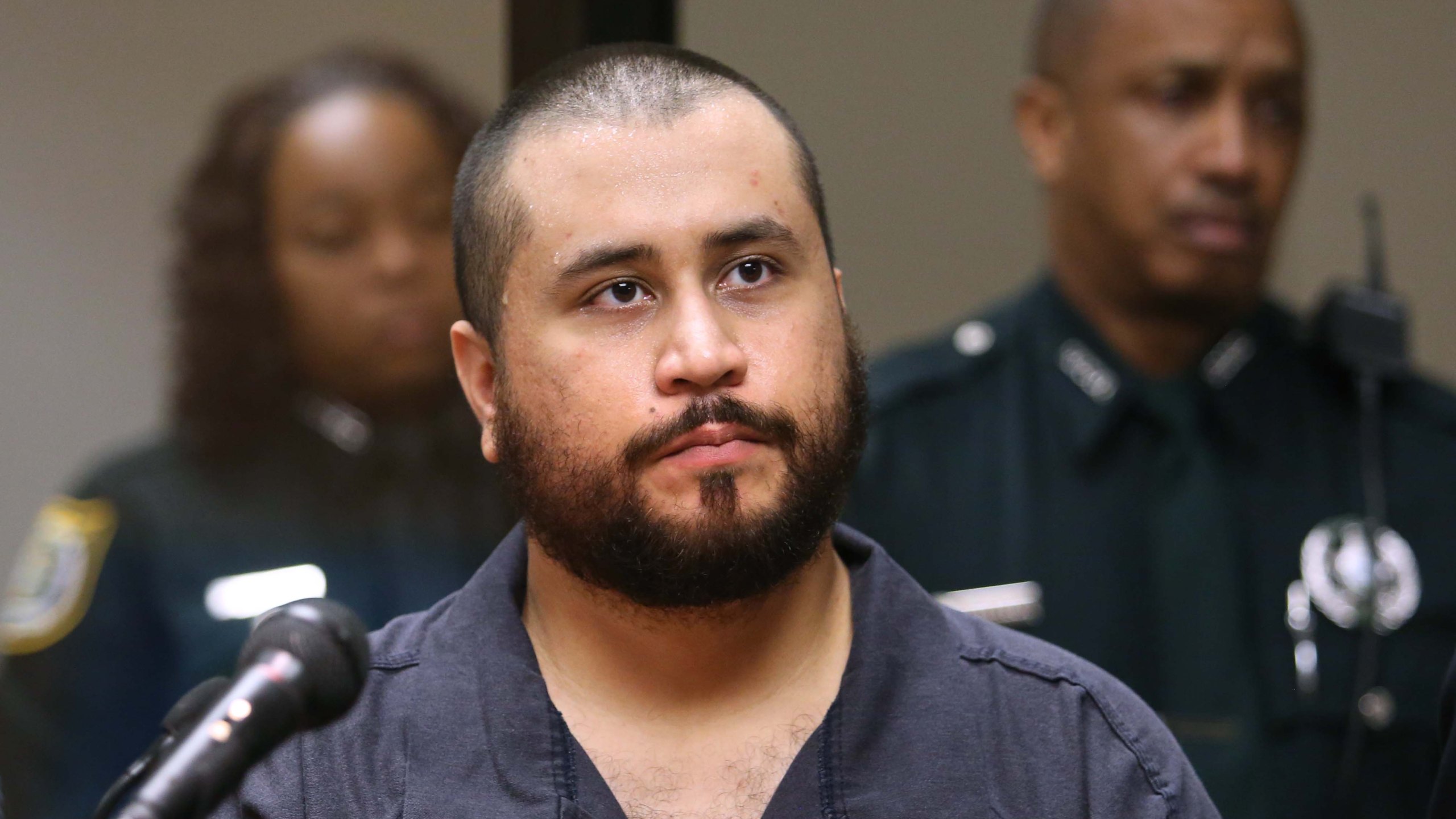 George Zimmerman, the acquitted shooter in the death of Trayvon Martin, faced a Seminole circuit judge during a first-appearance hearing on charges including aggravated assault stemming from a fight with his girlfriend November 19, 2013 in Sanford, Florida. (Credit: Joe Burbank-Pool/Getty Images)