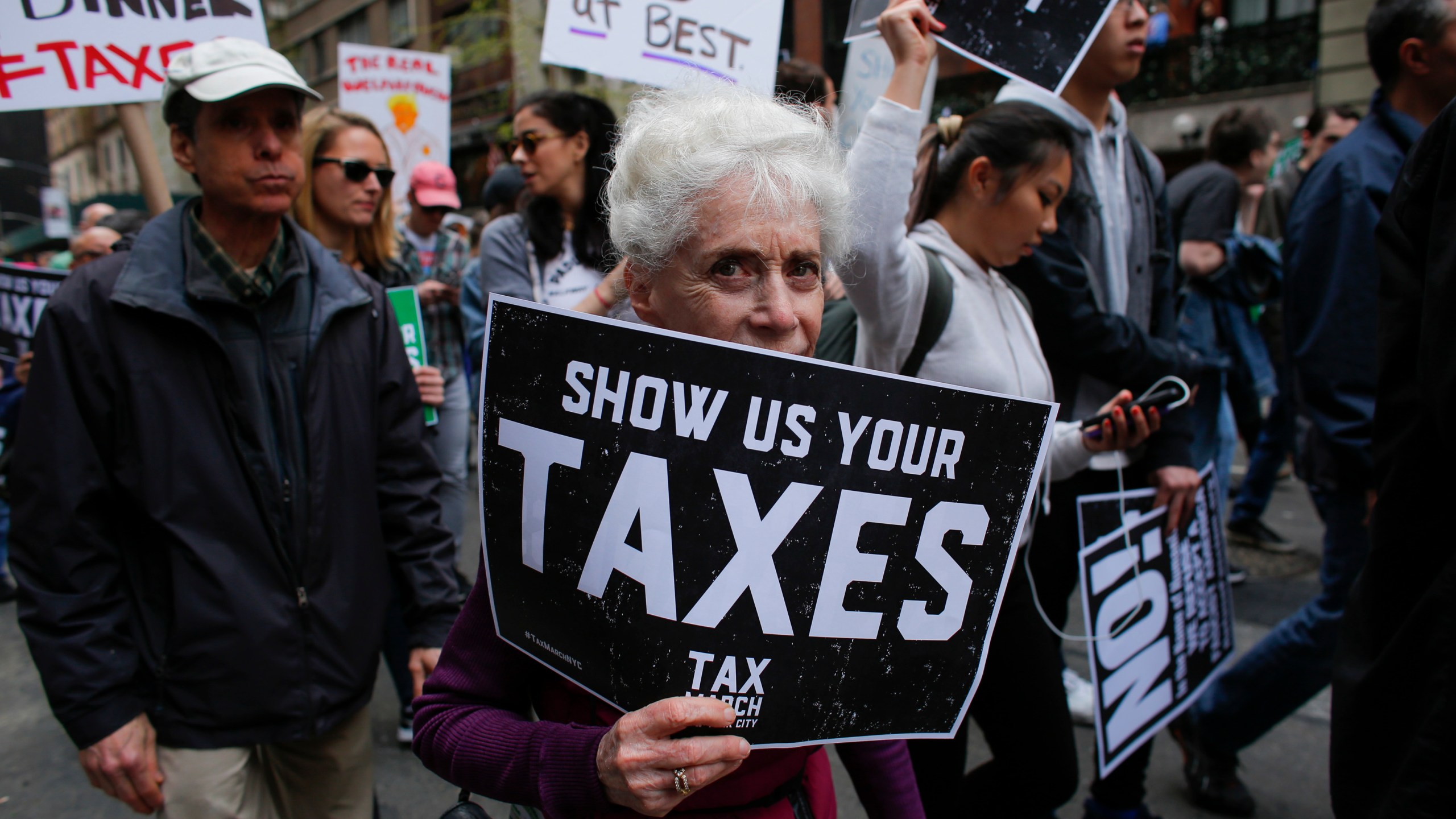 Protesters take part in the "Tax March" calling on Donald Trump to release his tax records on April 15, 2017 in New York. (KENA BETANCUR/AFP/Getty Images)