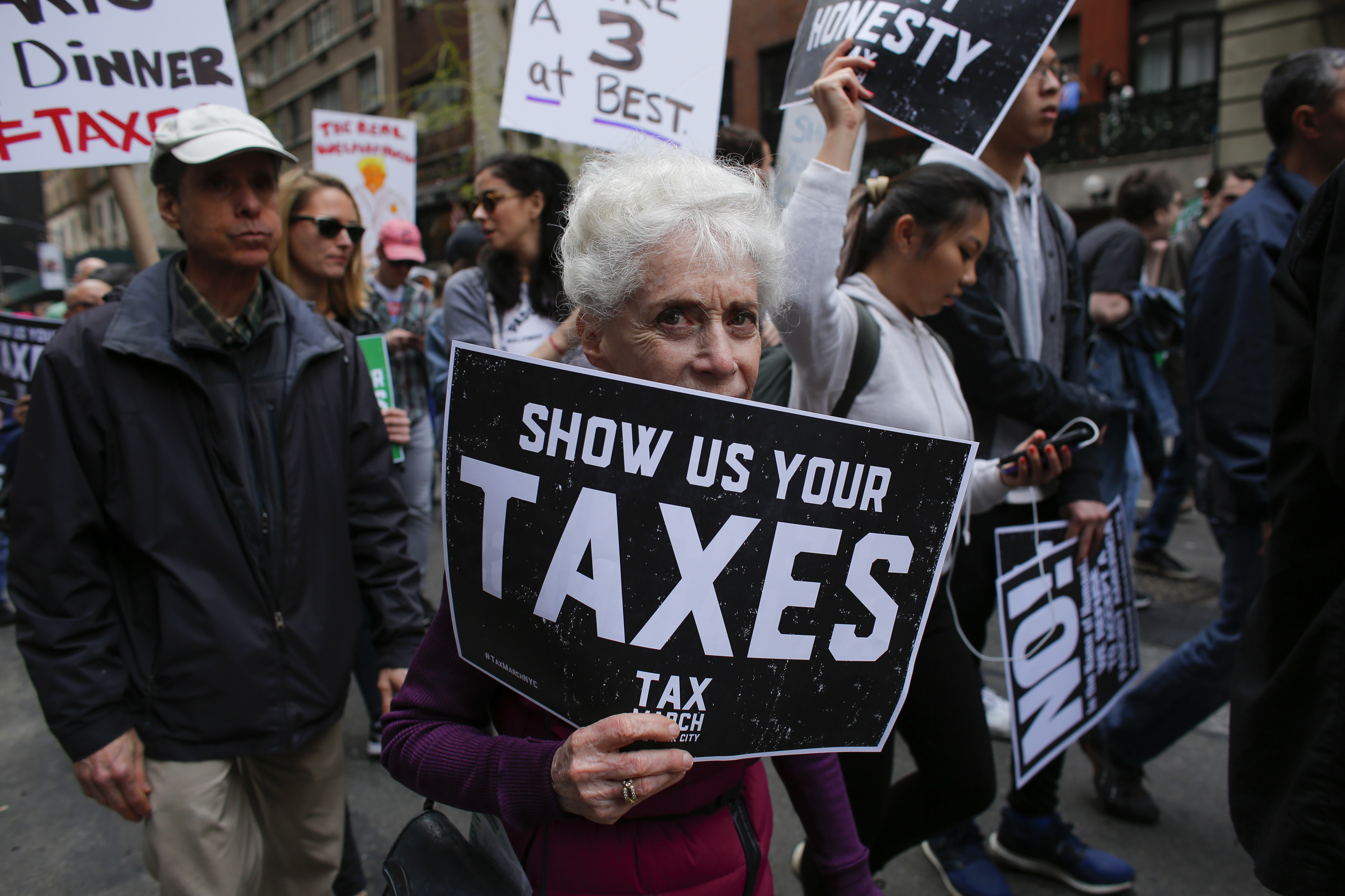 Protesters take part in the "Tax March" calling on Donald Trump to release his tax records on April 15, 2017 in New York. (KENA BETANCUR/AFP/Getty Images)