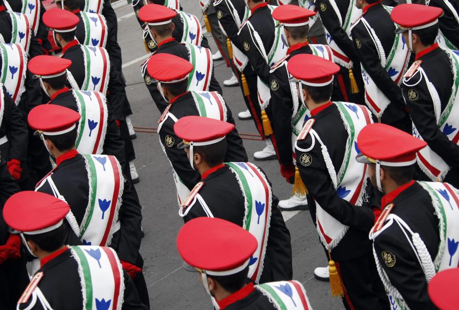 Iranian military policemen stand guard during a rally marking the 30th anniversary of the Islamic revolution in Tehran on February 10, 2009. (Credit: BEHROUZ MEHRI/AFP/Getty Images)