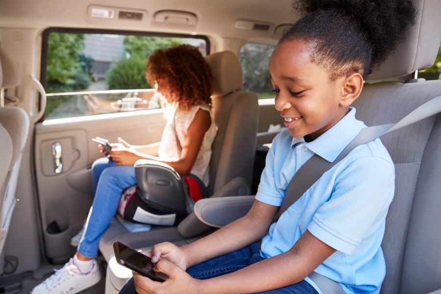 Children are seen in a booster seat in this file photo. (Credit: iStock / Getty Images Plus)