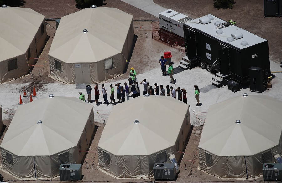 Children and workers are seen at a tent encampment built near the Tornillo Port of Entry on June 19, 2018 in Tornillo, Texas. (Credit: Joe Raedle/Getty Images)