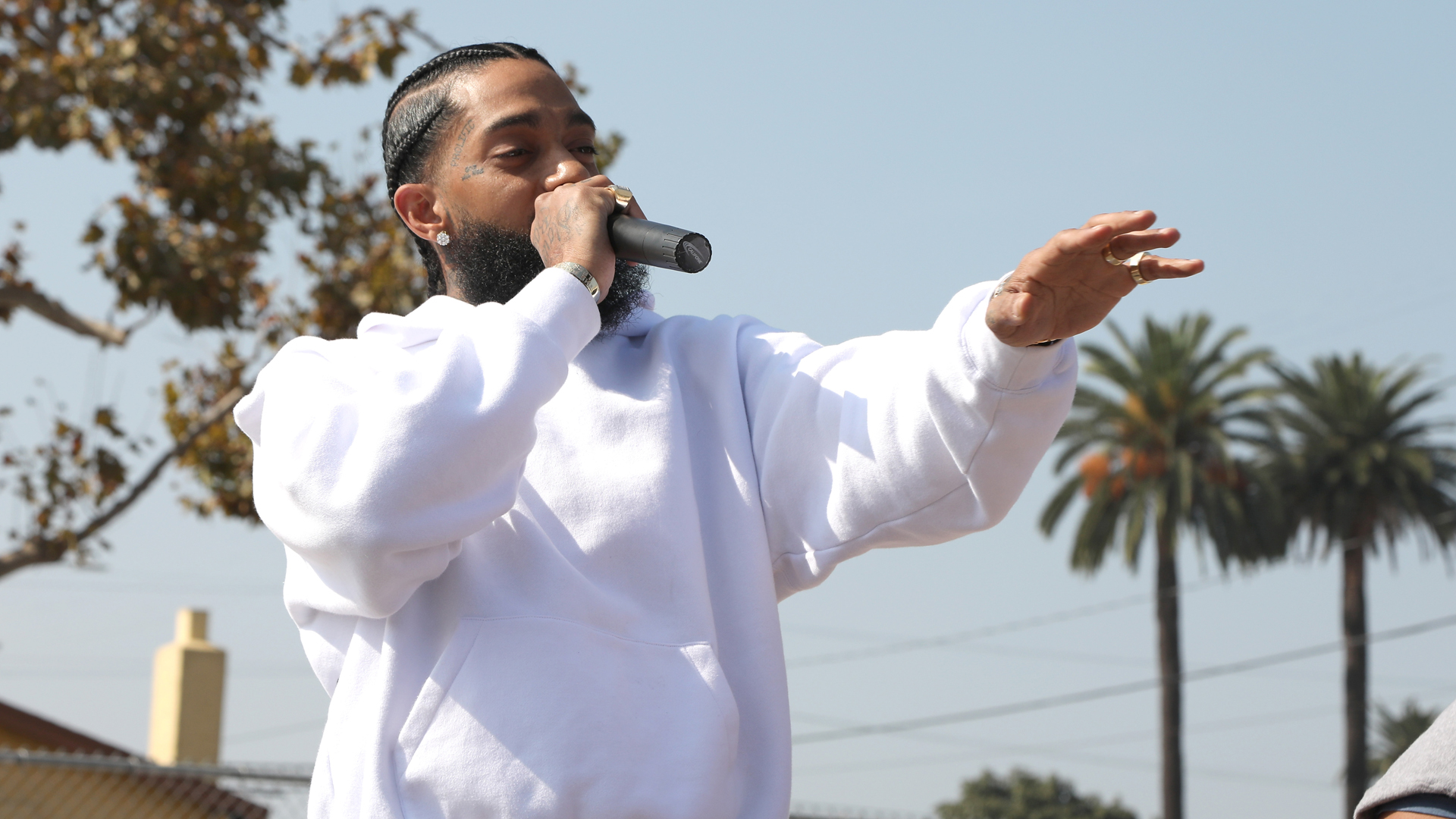 Nipsey Hussle speaks to kids at the Nipsey Hussle x PUMA Hoops Basketball Court Refurbishment Reveal Event on Oct. 22, 2018, in Los Angeles. (Credit: Jerritt Clark/Getty Images for PUMA)