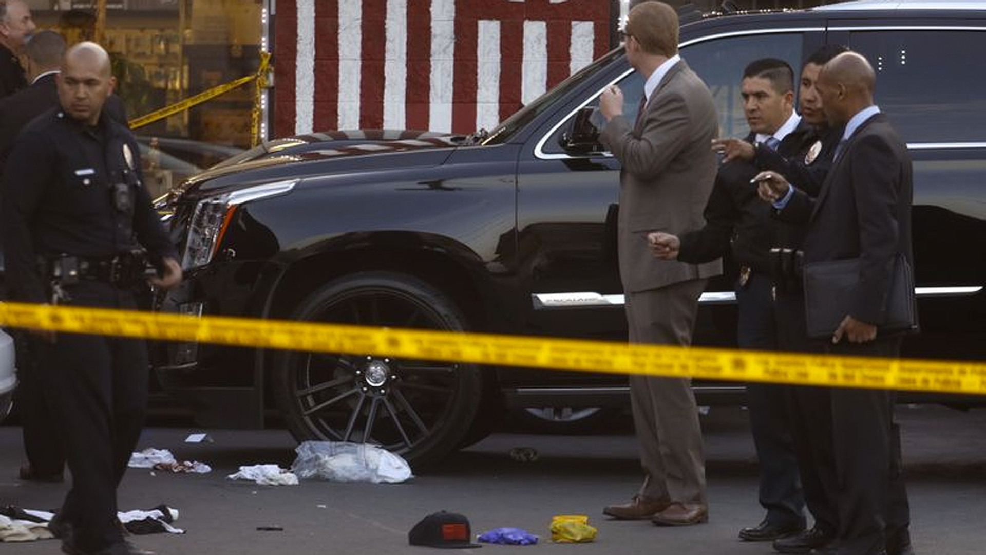 Police investigate the scene where rapper Nipsey Hussle was killed in a shooting outside his store that left two others wounded in South L.A.'s Hyde Park on March 31, 2019. (Credit: Genaro Molina / Los Angeles Times)