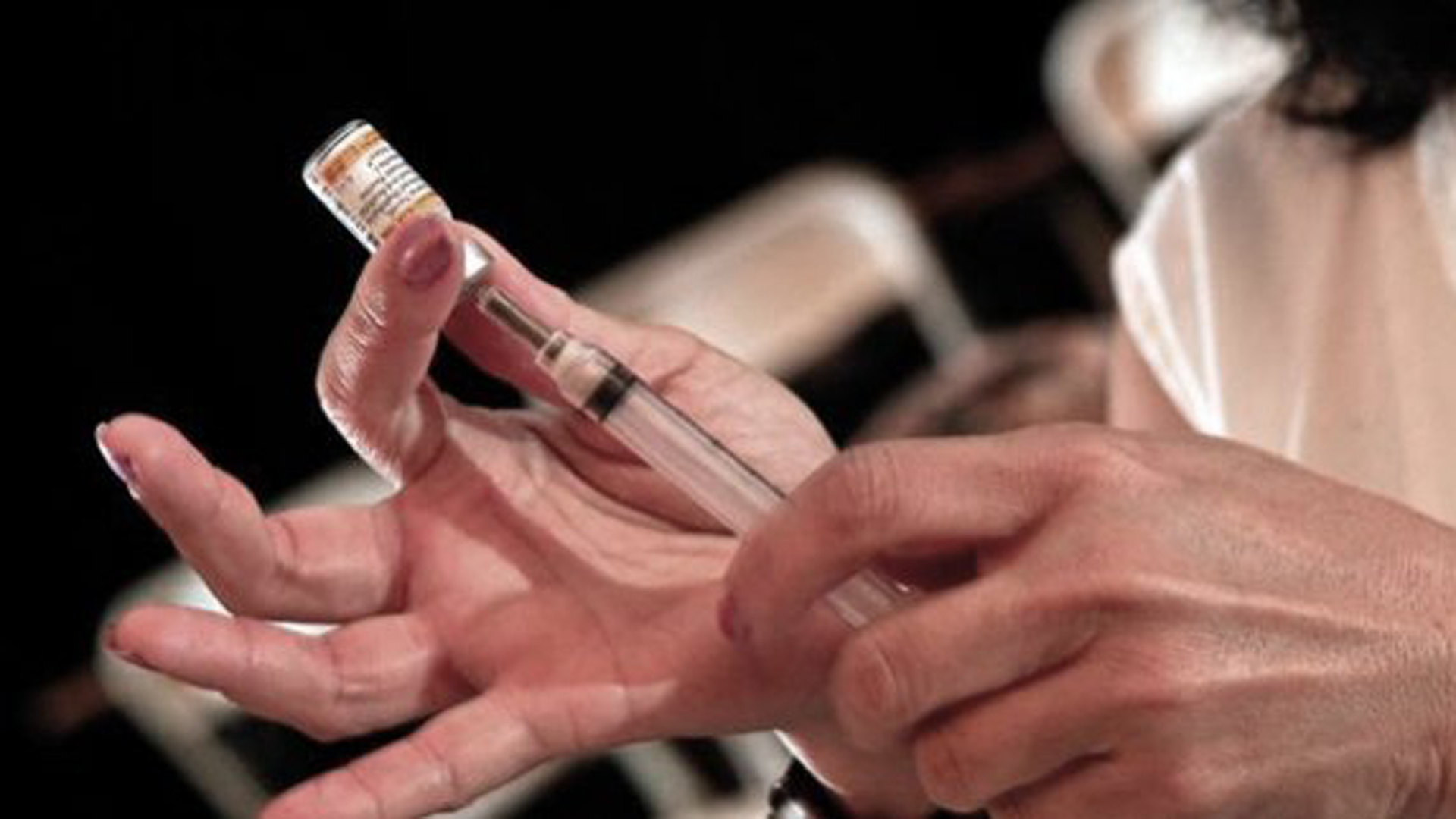 A Los Angeles Unified School District nurse prepares a whooping cough vaccine for a student at Huntington Park High School in 2011. The district has a number of upcoming clinics where students can get vaccinated. (Credit: Los Angeles Times)