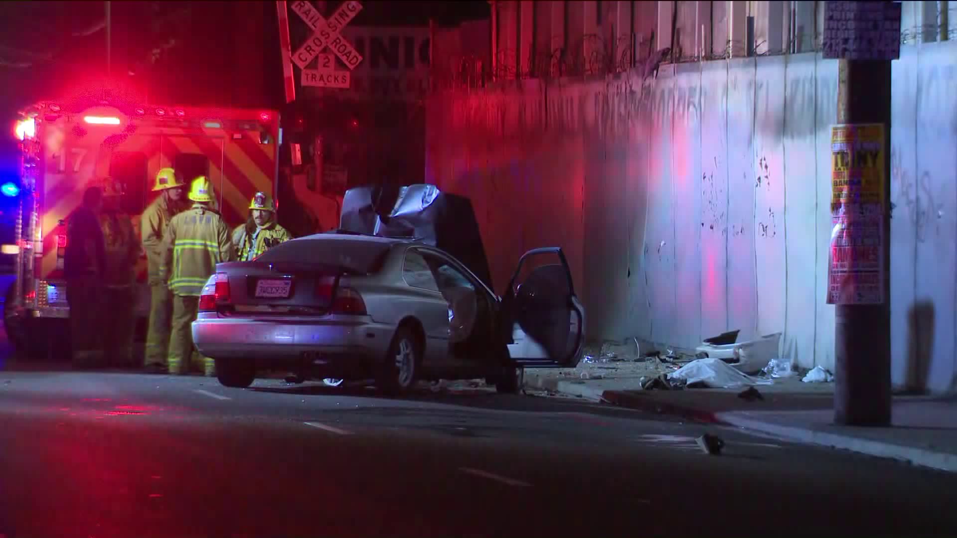 Los Angeles firefighters work at the scene of crash that left a bicyclist dead along Alameda Street in downtown Los Angeles on May 9, 2019. (Credit: KTLA)