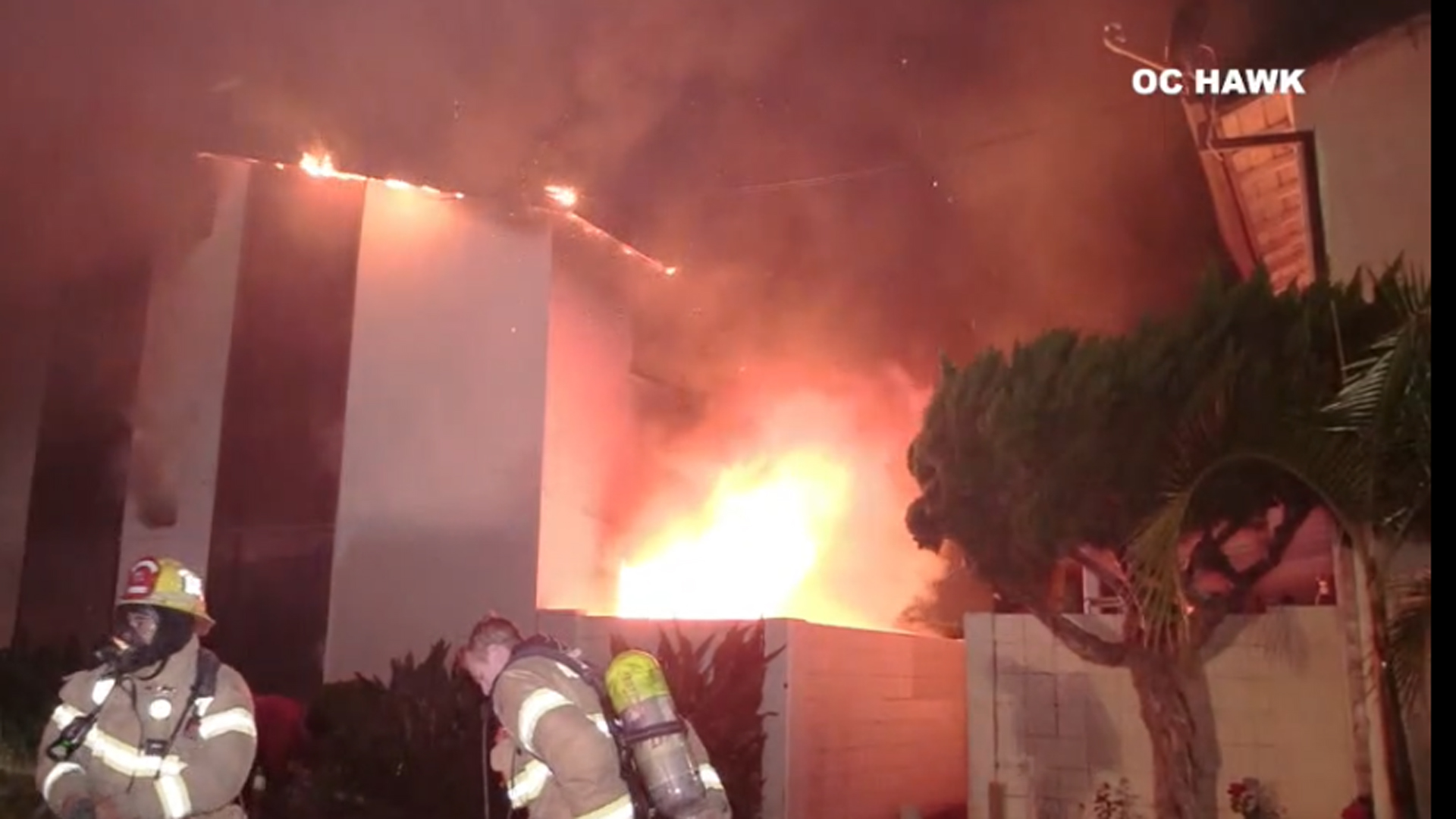 A fire burns at an apartment building in Anaheim as firefighters work to put out the flames May 26, 2019. (Credit: OC Hawk)