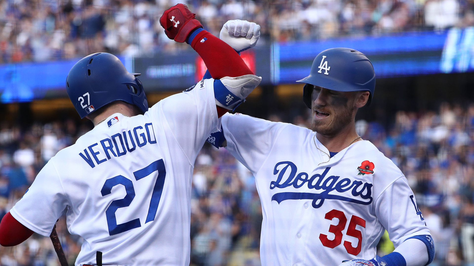 Cody Bellinger #35 of the Los Angeles Dodgers celebrates with teammate Alex Verdugo #27 after Bellinger hit a solo home run to right field in the third inning of the MLB game against the New York Mets at Dodger Stadium on May 27, 2019. (Victor Decolongon/Getty Images)