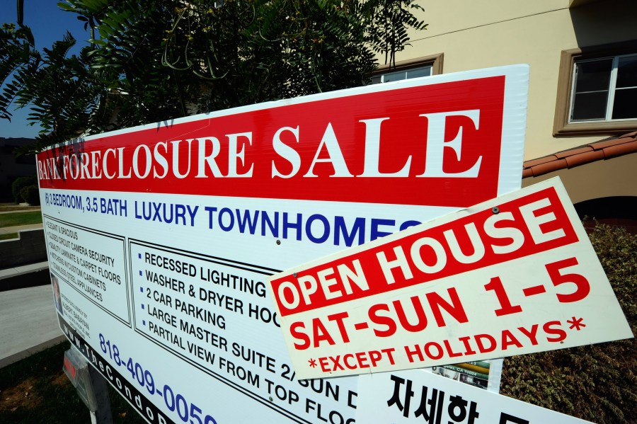 A "bank foreclosure sale" sign is posted in front of townhomes in Los Angeles on Aug. 12, 2010. (Credit: Kevork Djansezian / Getty Images)