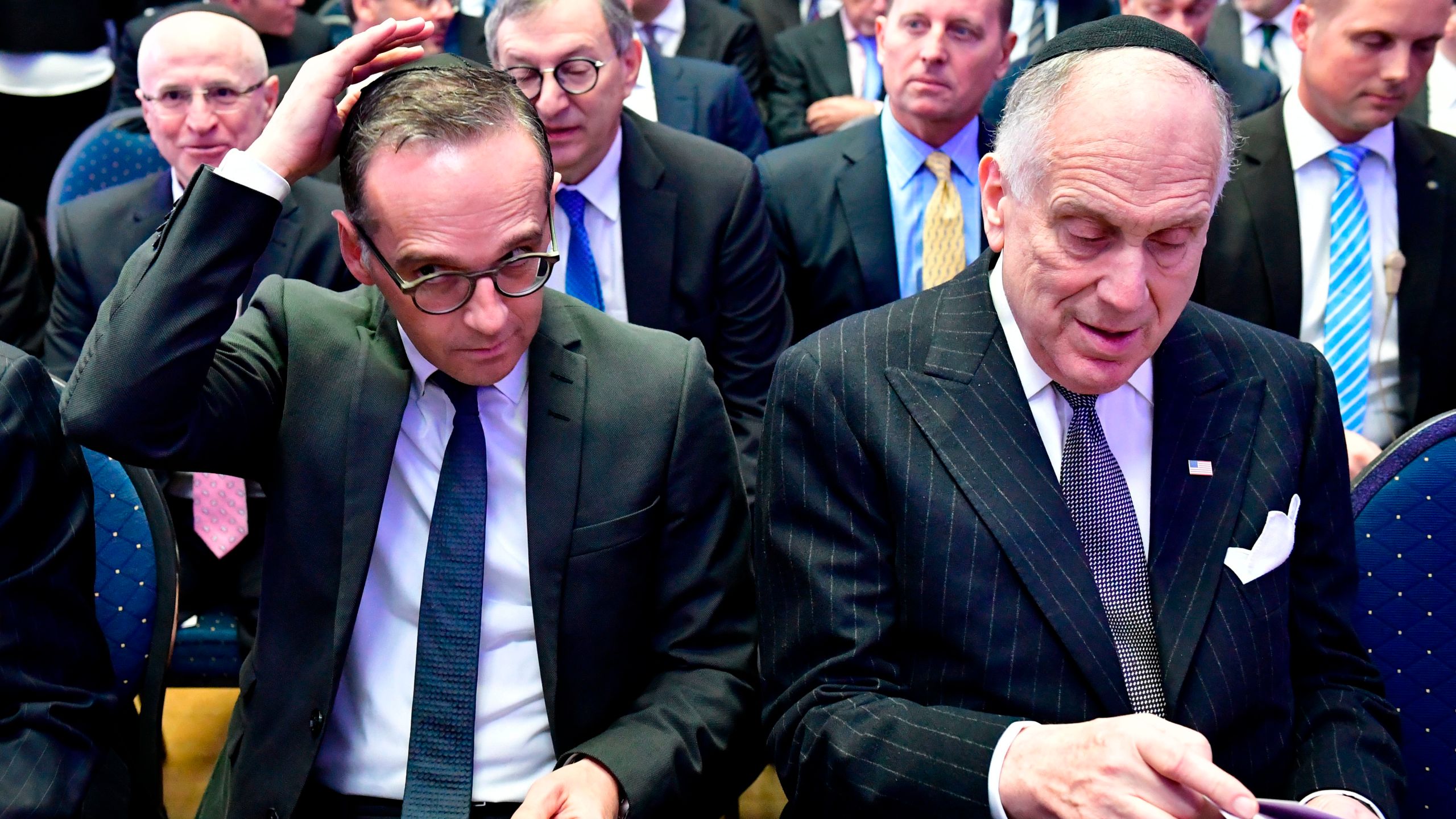 Foreign minister Heiko Maas (L) adjusts his Jewish kippa skullcap next to the President of the World Jewish Congress Ronald Lauder prior the solemn ordination ceremony of three rabbis and three cantors at the Bet Zion synagogue in Berlin, Germany, on Oct. 8, 2018. (Credit: Tobias SCHWARZ / AFP) /Getty Images)