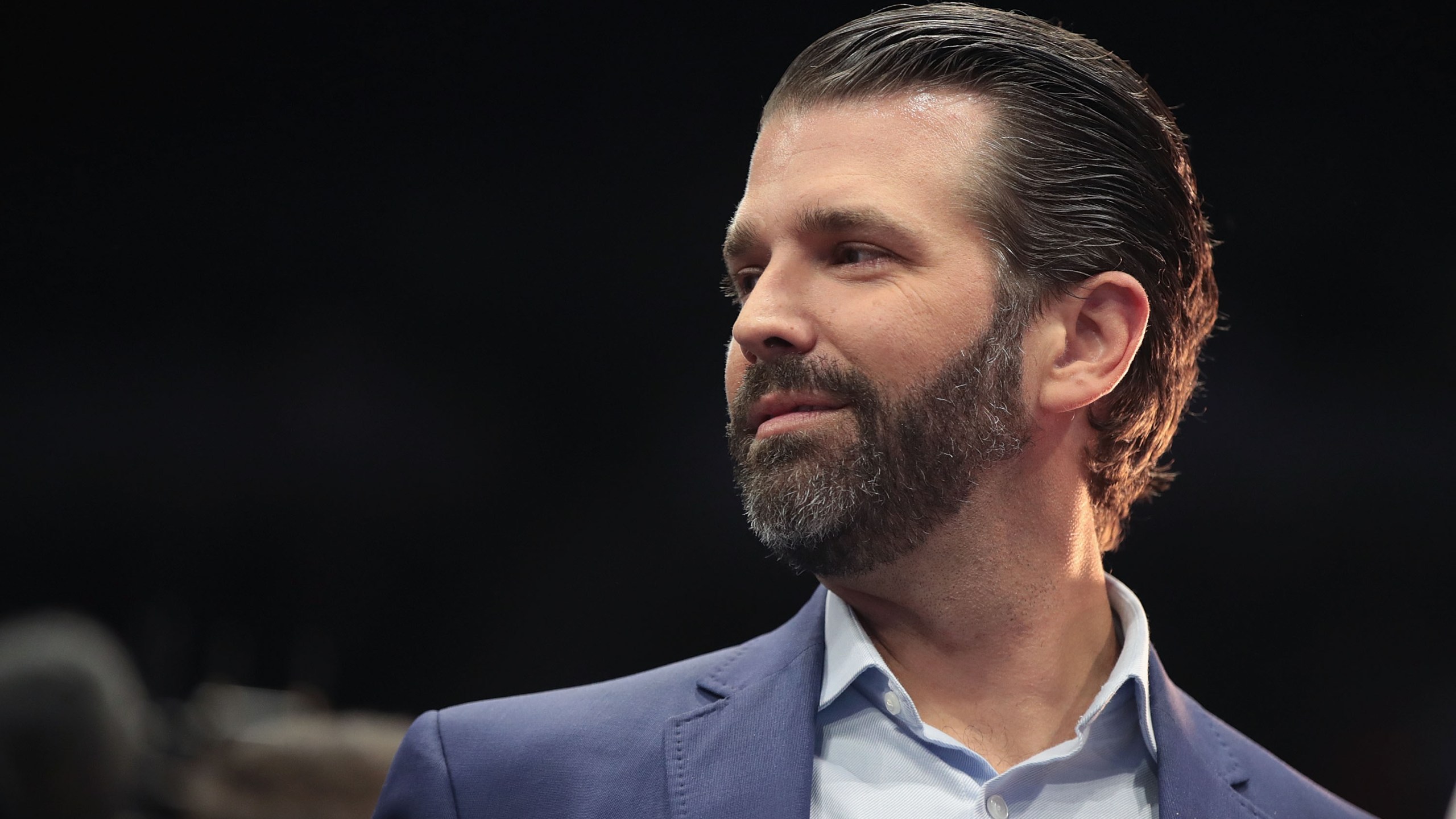 Donald Trump Jr. talks to the press before the arrival of his father President Donald Trump during a rally at the Van Andel Arena in Grand Rapids, Michigan on March 28, 2019. (Credit: Scott Olson/Getty Images)