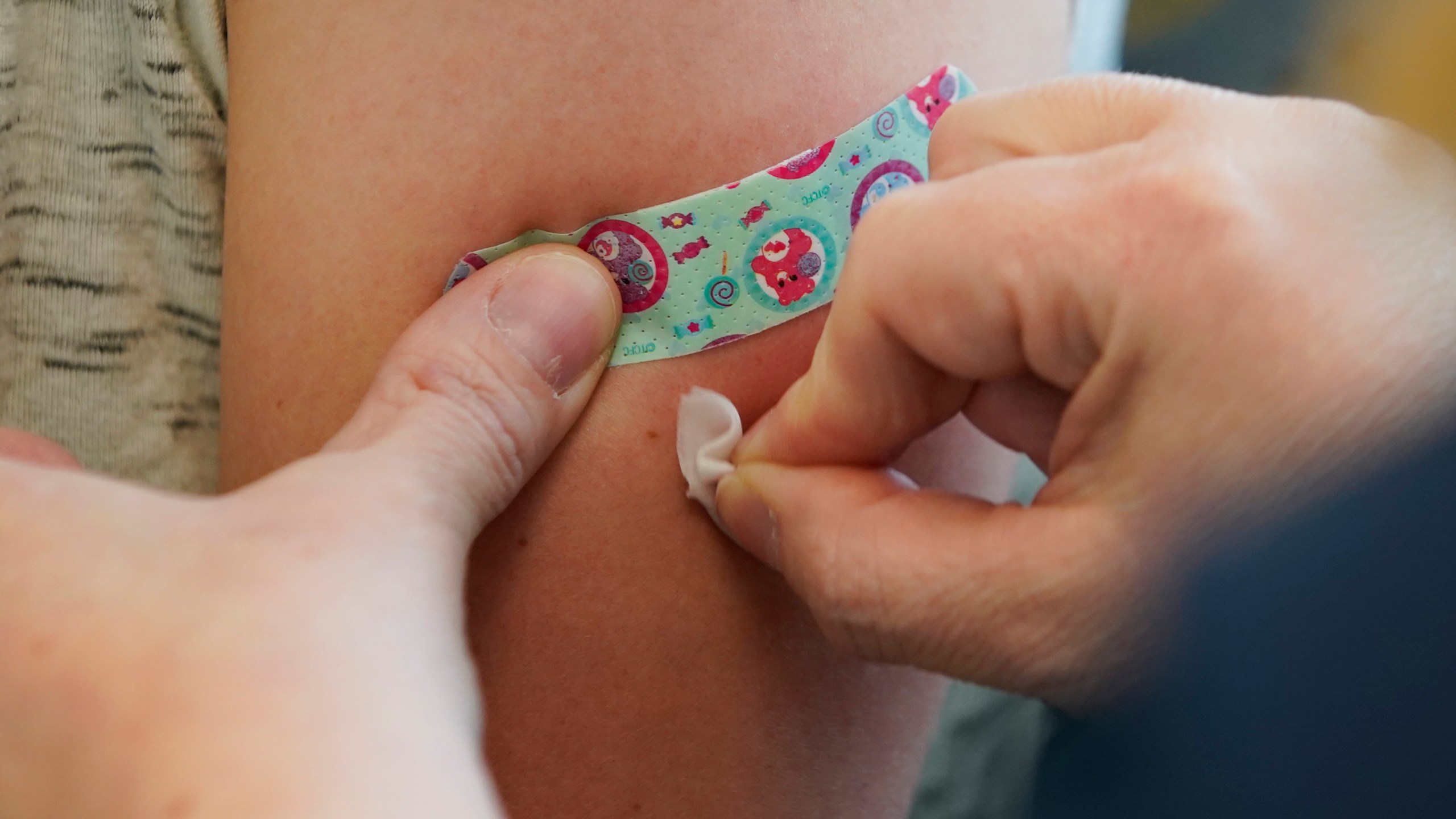 A nurse prepares the arm of a woman receiving a measles, mumps and rubella virus vaccine at the Utah County Health Department in Provo on April 29, 2019. (Credit: George Frey / Getty Images)