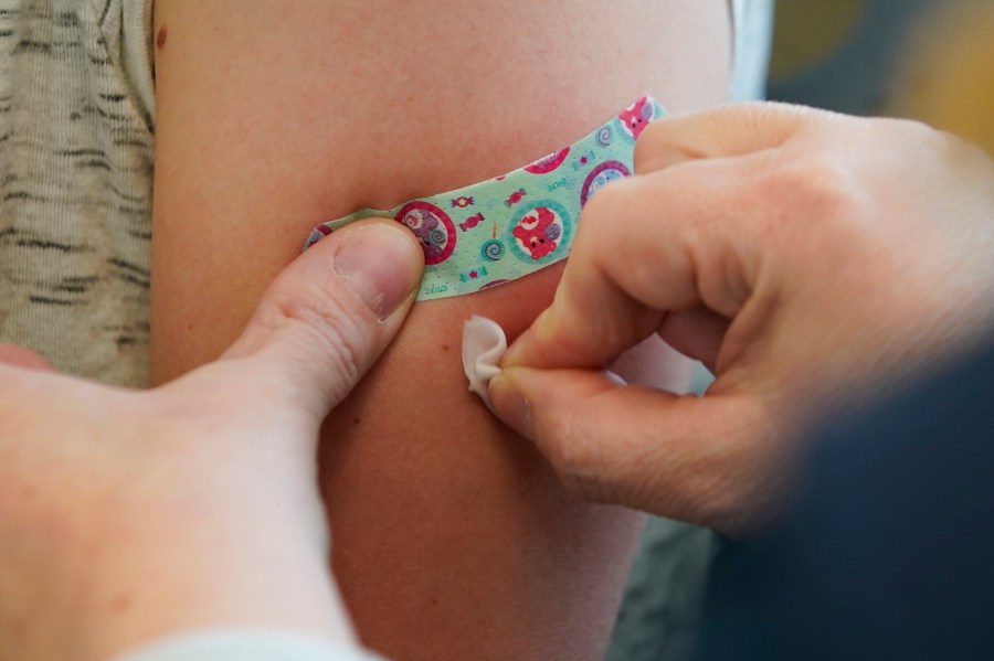 A nurse prepares the arm of a woman receiving a measles, mumps and rubella virus vaccine at the Utah County Health Department in Provo on April 29, 2019. (Credit: George Frey / Getty Images)